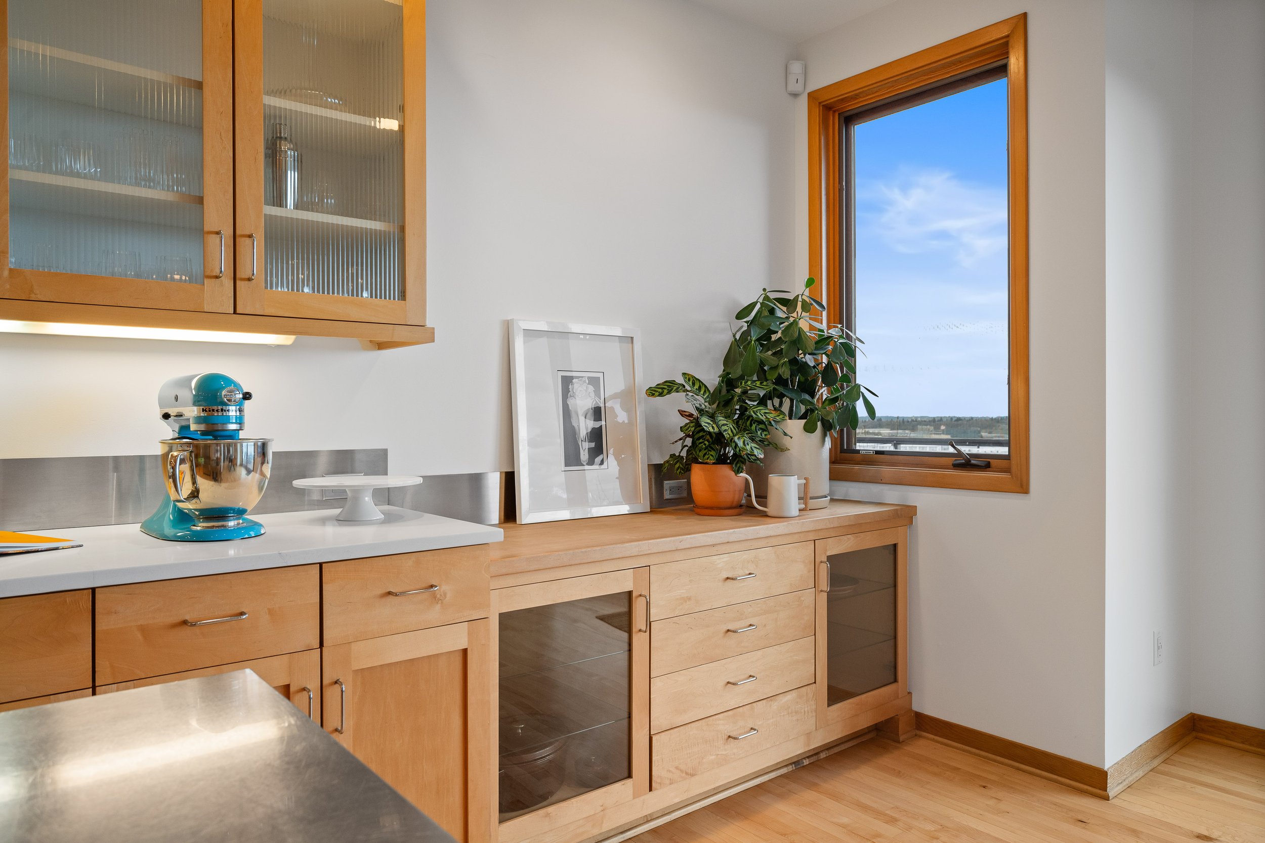  Custom floor-to-ceiling sliding doors open to an expansive view deck. 