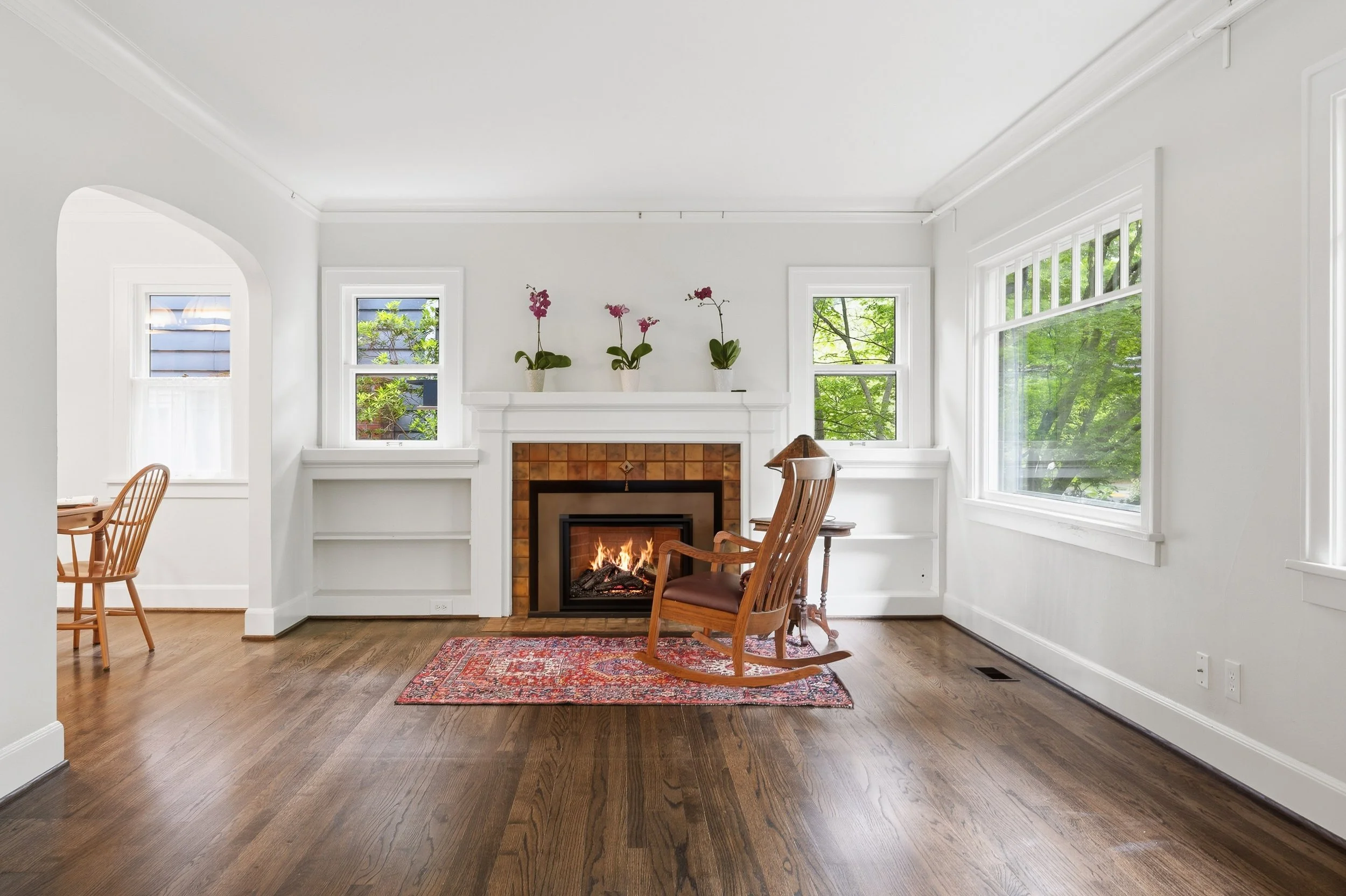  Gleaming refinished hardwood floors, period archways, original built-in bookcases, picture rails, and original door hardware. 