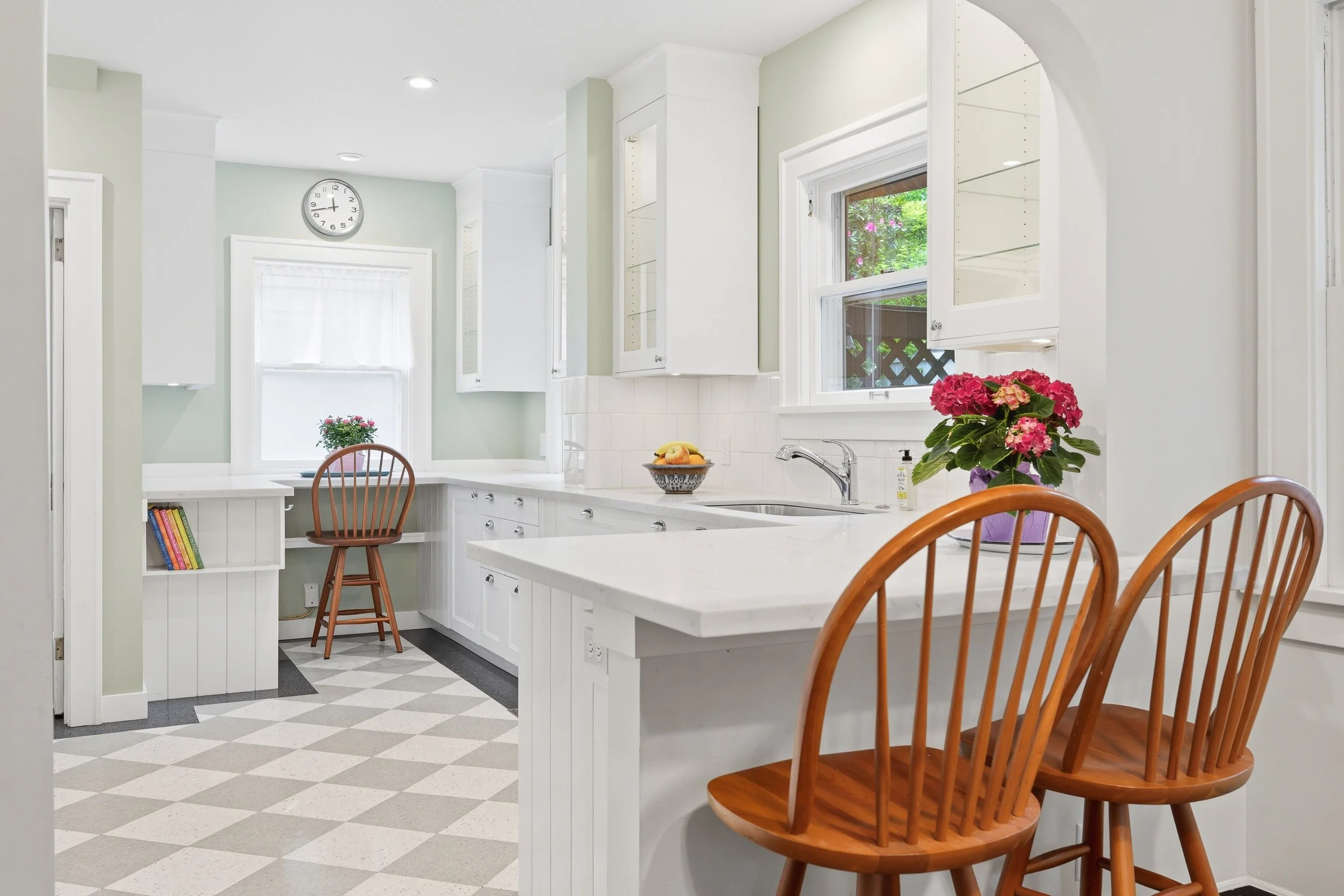  Three spacious bedrooms feature refinished original hardwood floors. 