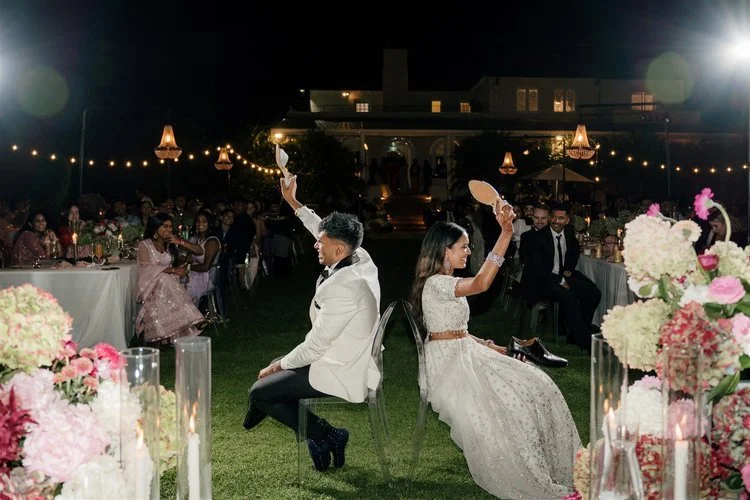 Celebrations at the outdoor wedding reception for Ahranni and Kritesh at Puketutu Island Resort.