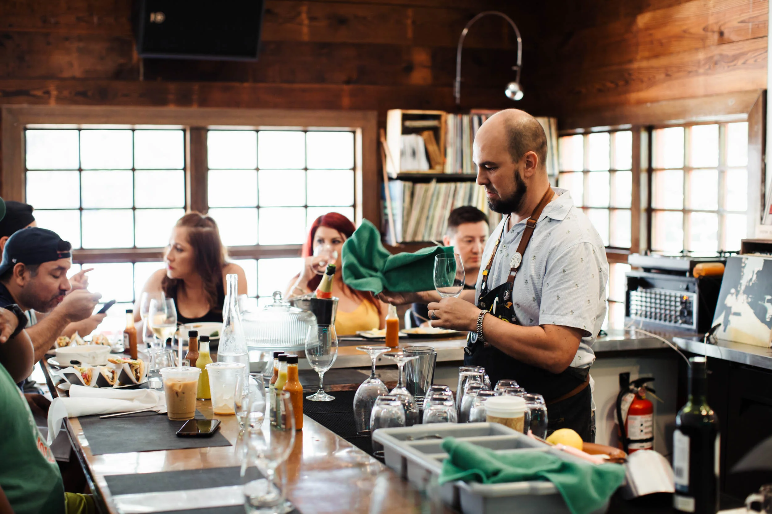 David Trammell, General Manager of Taco y Vino, tending the bar.