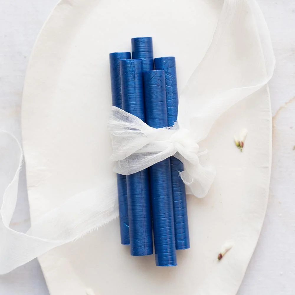 Wax sticks. Each one will get you roughly 7-10 seals, so I recommend comfortably about 35 sticks to get 200 seals.
