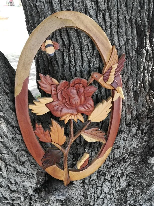 wooden art displayed on the oak tree