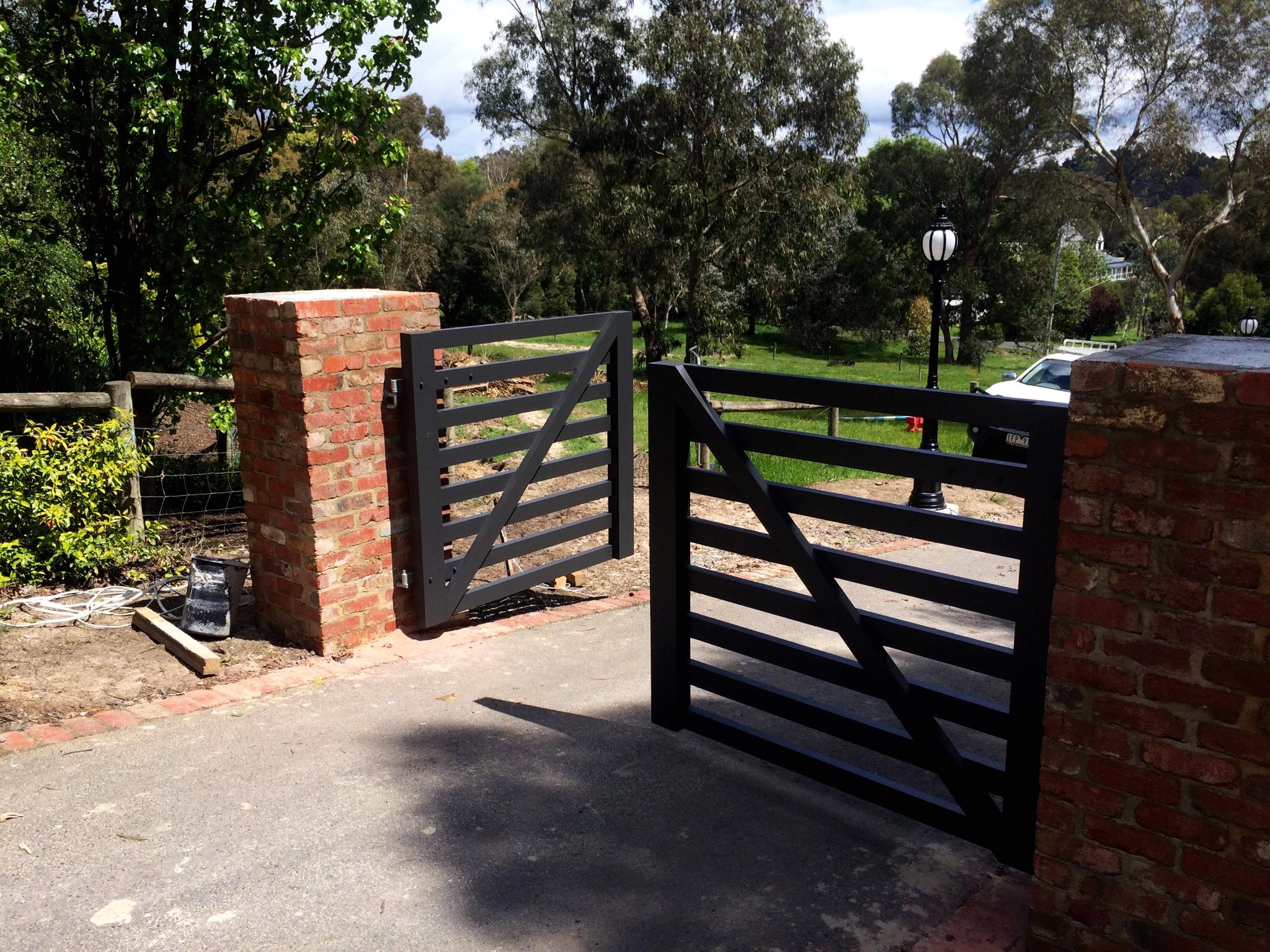 Driveway Gate Open Black Rails.jpg