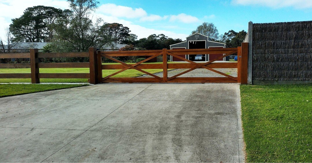 Two double-cross automatic sliding gates on a wonderful property in Pakenham, VIC. 

These hardwood timber gates measure 5.9m and 5.3m and they feature solid 200mm rails. They are the perfect design for a truck entrance and to match the existing post