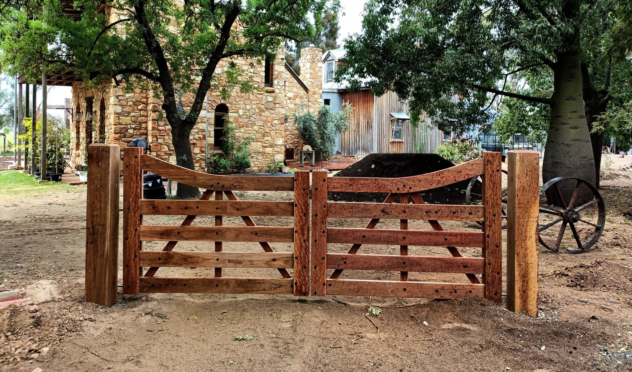 Customised install in Congupna 

These ironbark gates are our great sweep design which also feature optional plated black hardware. Installed with a rear-hinged setup that allows for an opening angle greater than 90 degrees, improving functionality b