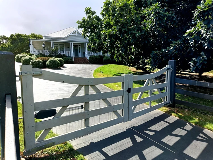 Timber gates and post and rail frontage at Warragul
