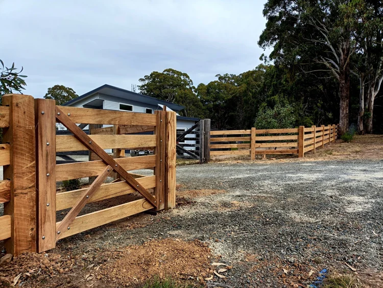 Four-rail frontage fencing with a matching timber pedestrian gate