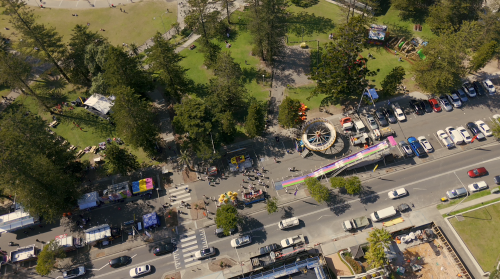 Aerial view of amusement rides and market stalls at CronullaFest in Cronulla Park