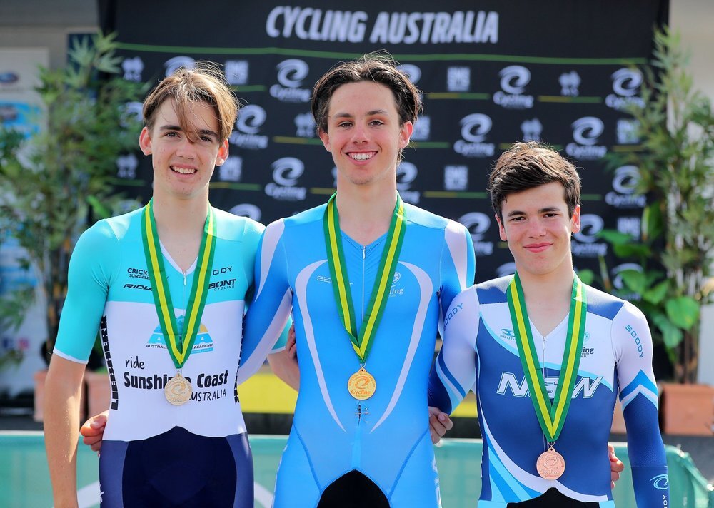 Pat Eddy (middle) after becoming the 2018 U17 national time trial champion.