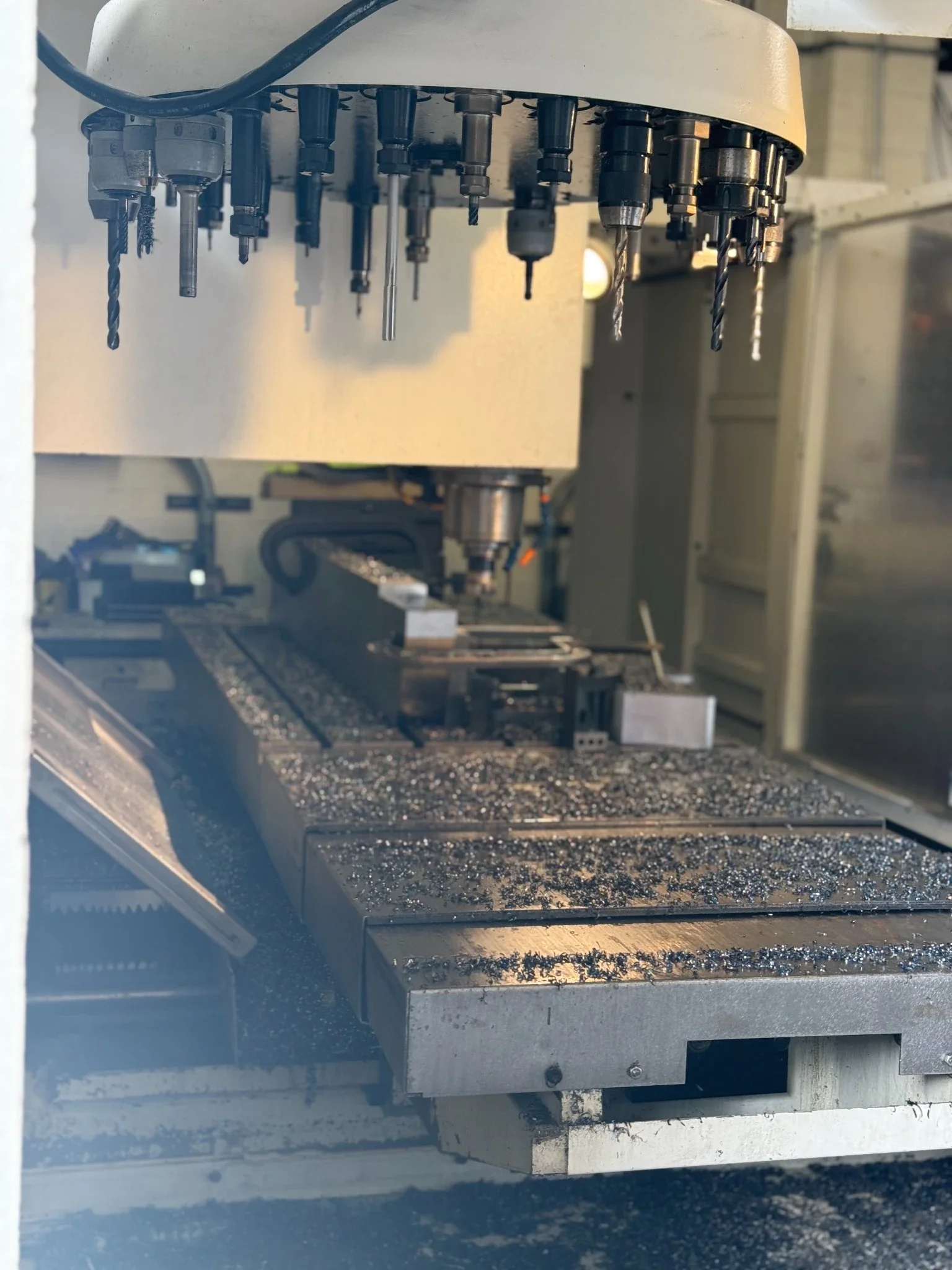 CNC milling machine with multi tool spindle machining precision metal parts at T&D Resources