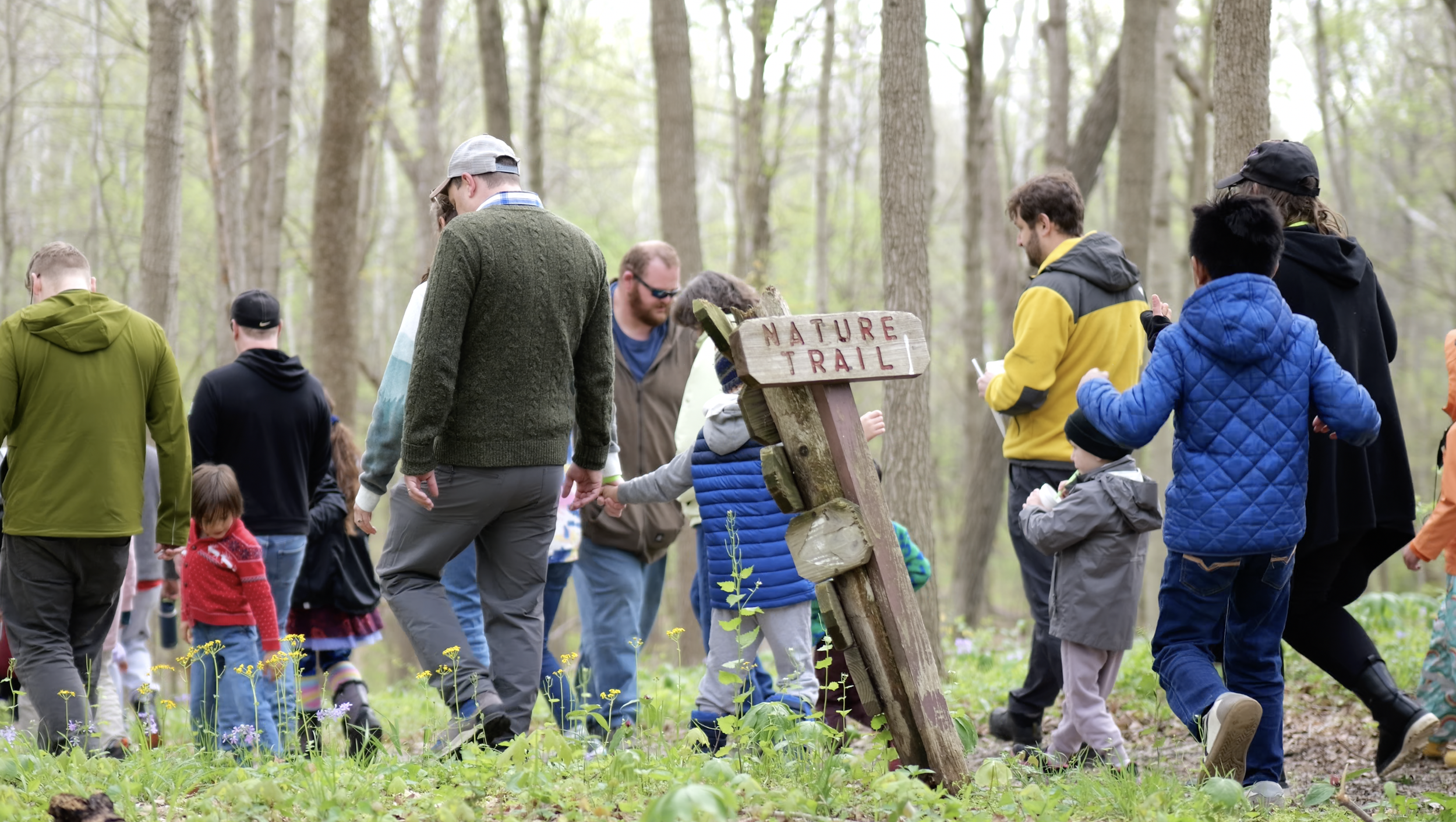 Guests exploring activities together at Forest Academy's Rooted in Resilience community event