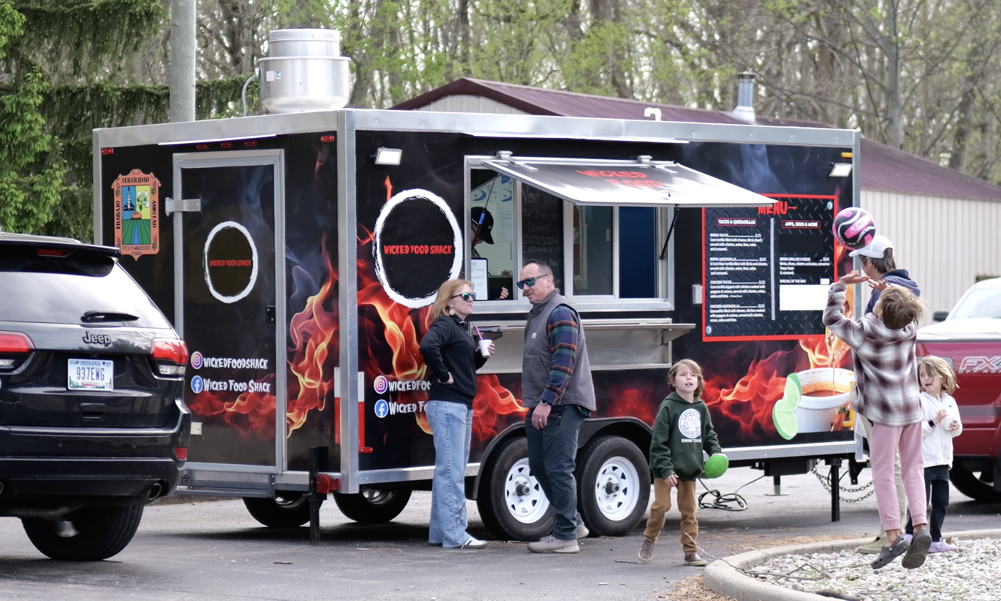 Families gathering at a food truck during a community event in Lafayette, Indiana