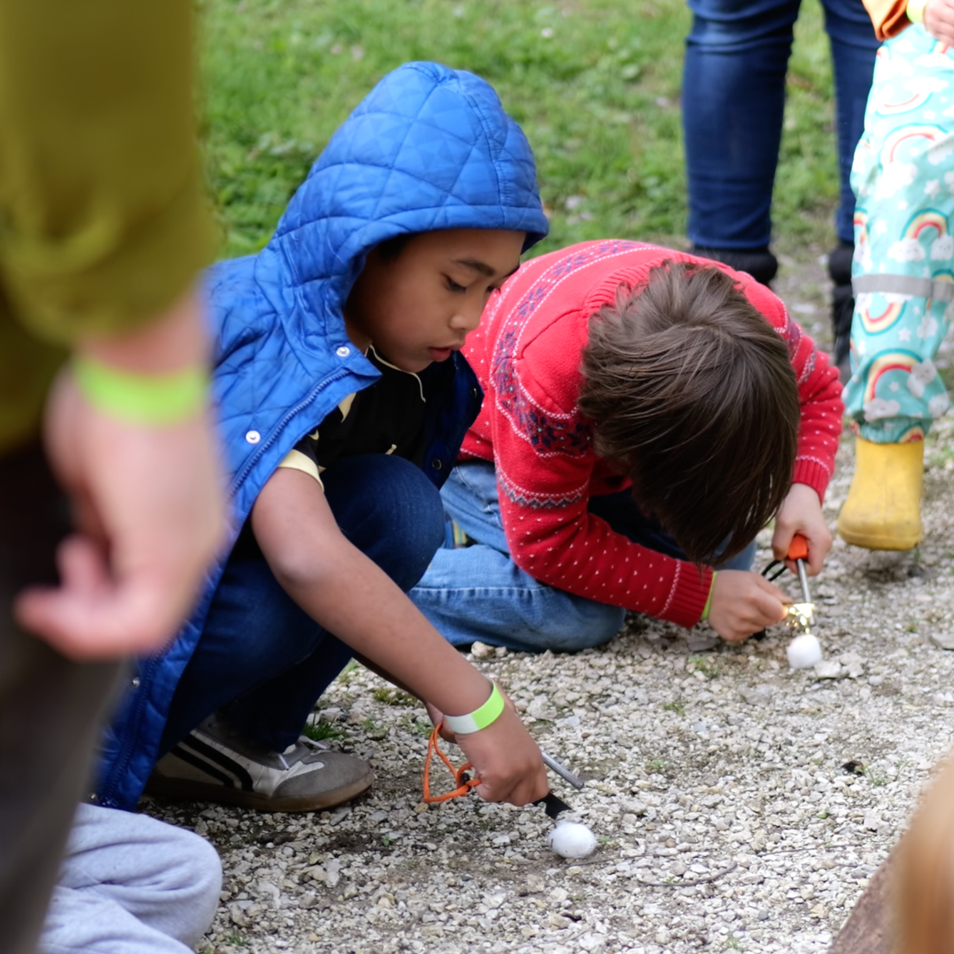 Children engaged in a hands-on activity at a community event hosted by Forest Academy
