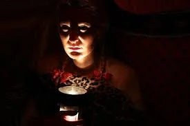 woman with flashlight under chin spooky.jpg