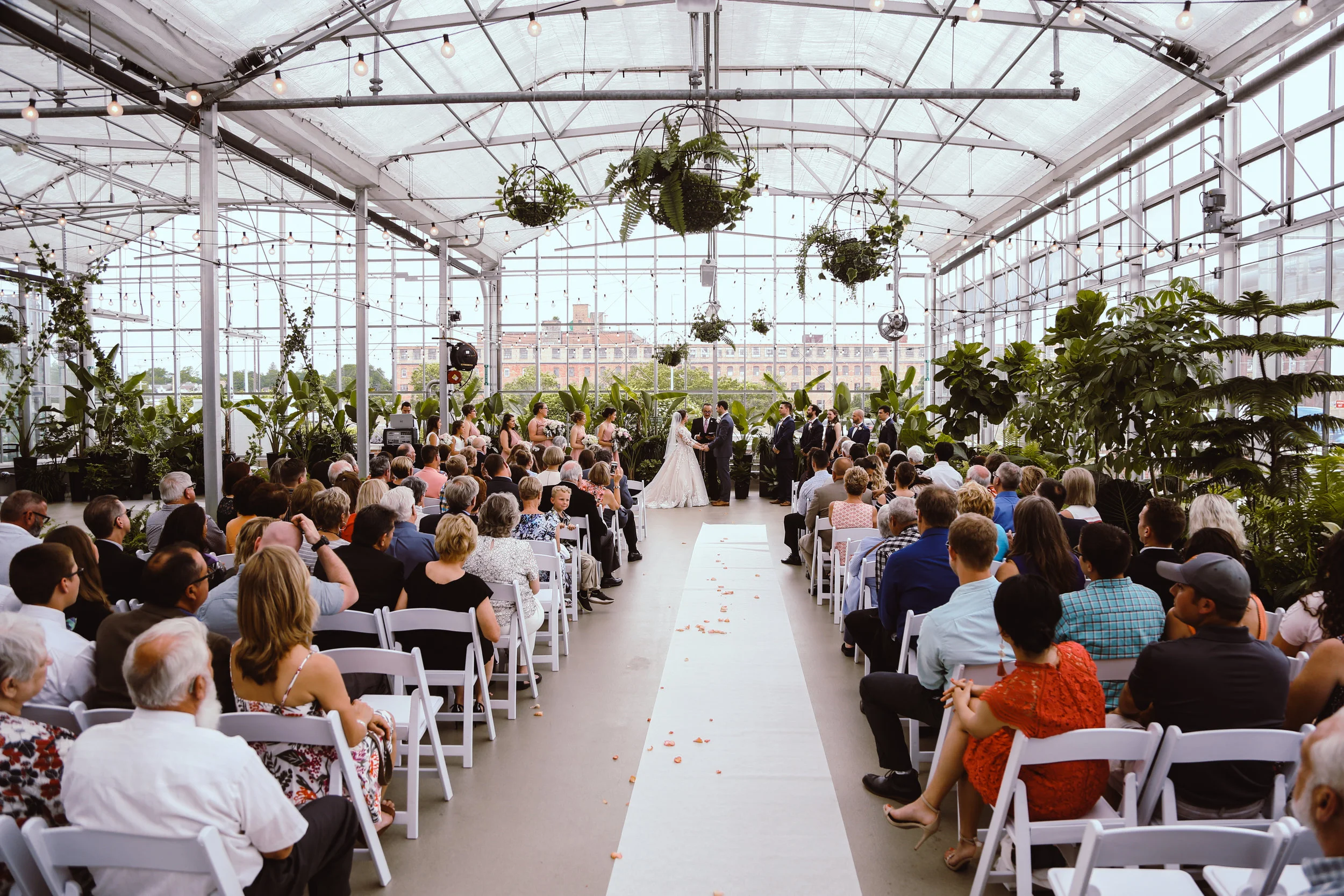 If you can’t tell from my images, I love natural light. So naturally, creating a gorgeous ceremony within a greenhouse is one of my favorite ideas. It creates an opportunity for natural light and a sense of life while still keeping temperatures regulated, easy access to elderly guests, and is not weather dependent.