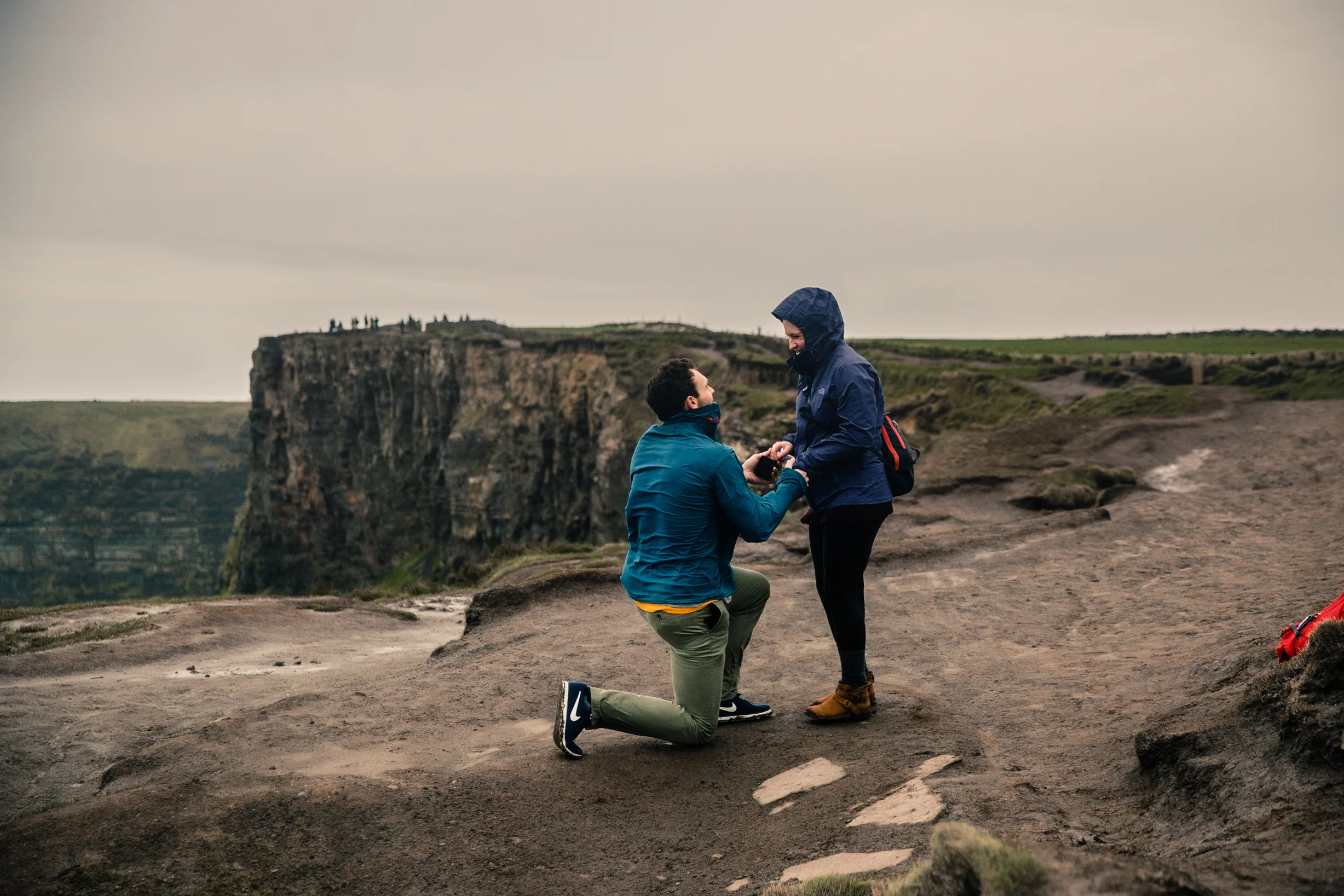 // They were in the world, and in a world of their own. // It was surreal joining Chris and Suzannah as he walked her out along the southern Cliffs of Moher, handed her a letter and dropped to one knee. Proposals are the beginning. They’re a treasured, intimate moment that you may not be asked about 30 or 40 years into your marriage, but when you look back across your relationship, it’s quintessential. While I have a few tips for making it a perfect day without compromising the surprise, I love hiding in plain site as you walk to your spot and have one of the most intimate moments you can legally have in public. I’d like to see more people incorporate these moments into their travels and vacations, AND bring a photographer along to capture the moment. Your family will thank you for letting them be a part of this personal moment when they’re not around.