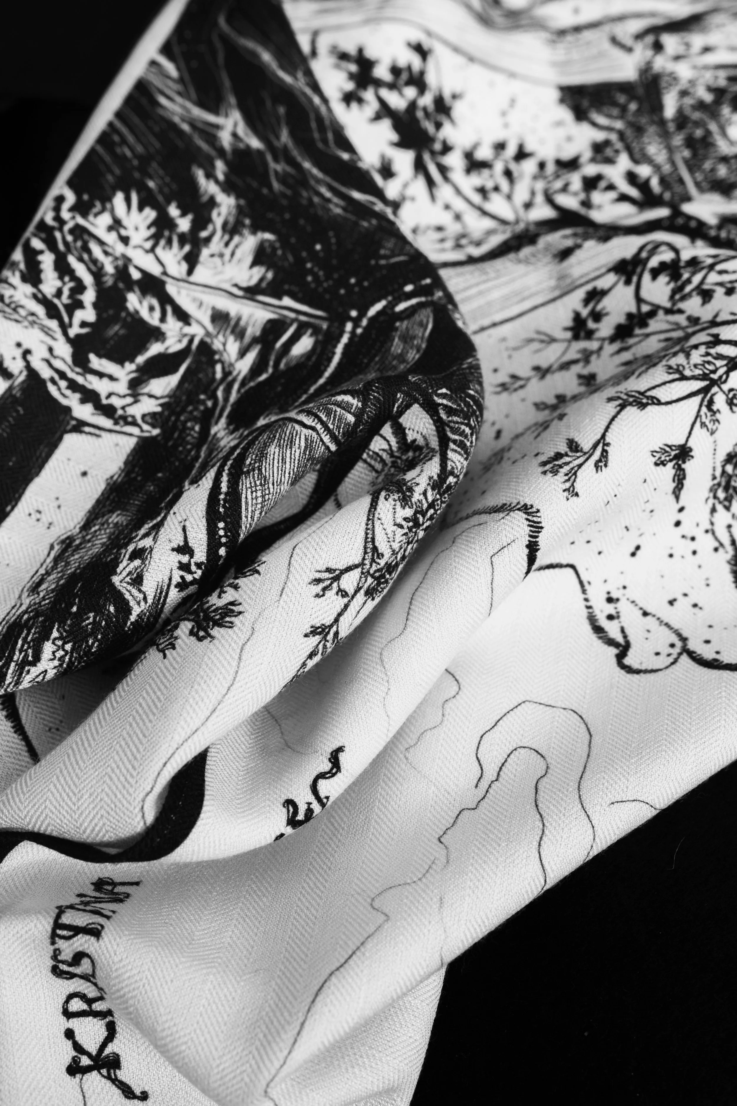 DEEP FOREST in black and white wool silk shawl — draped fabric close-up