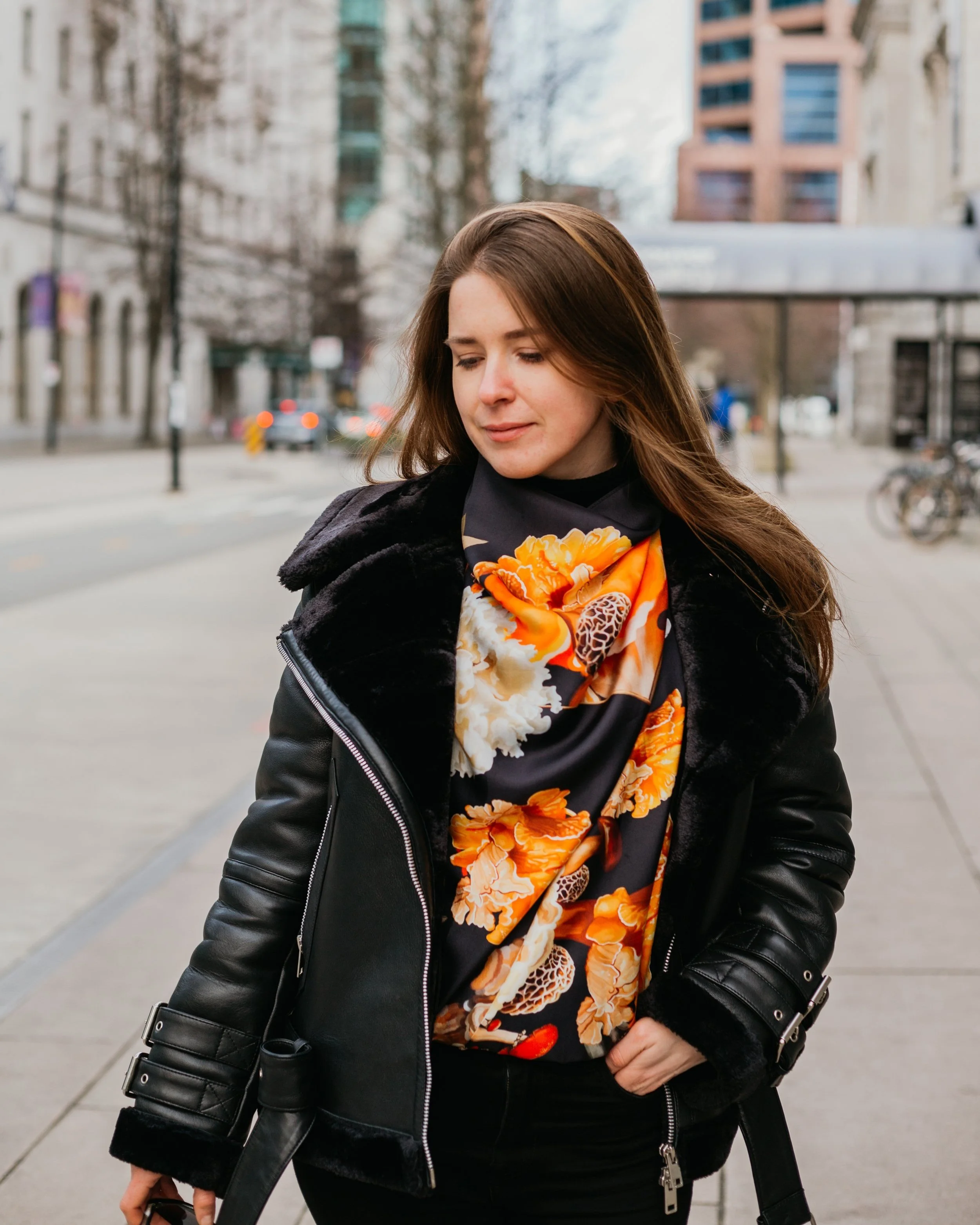 UNITY - in Black - silk scarf — styled with a black leather jacket on a city street