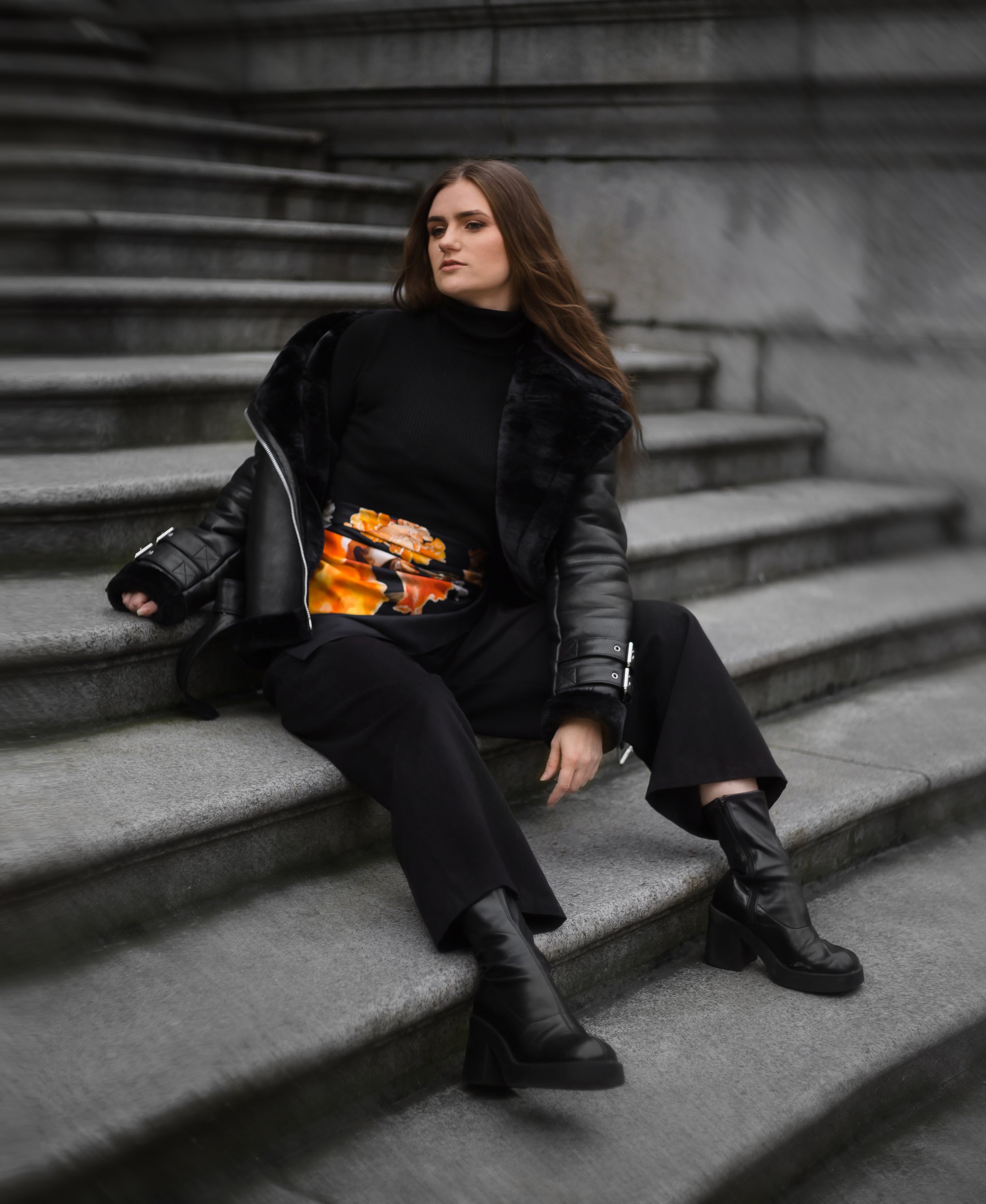 UNITY - in Black - designer silk scarf — woman in black wearing the scarf on steps