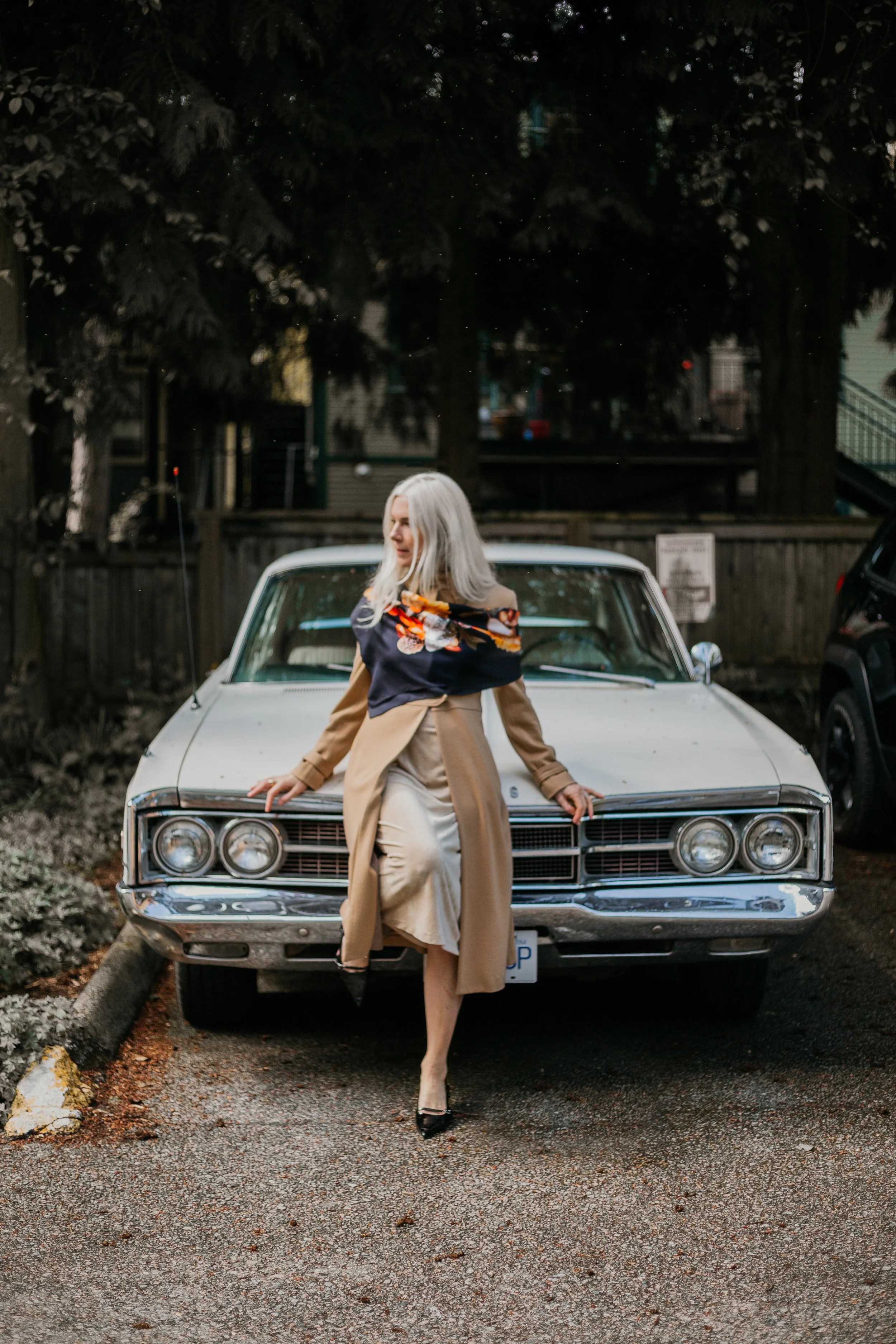 UNITY - in Black - designer silk scarf — woman wearing the scarf by a vintage car