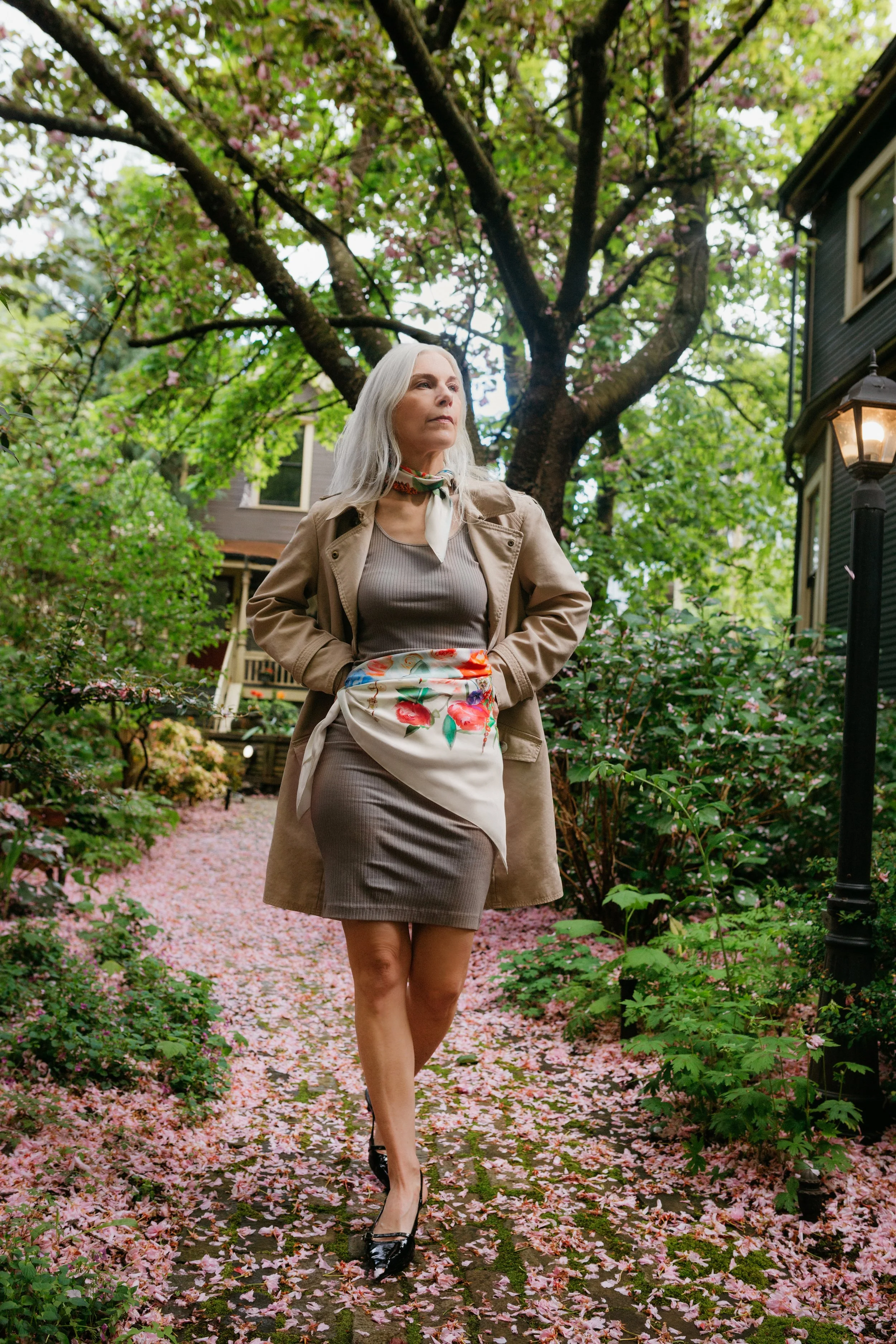 SOUL GARDEN in ivory silk scarf — worn on a garden path