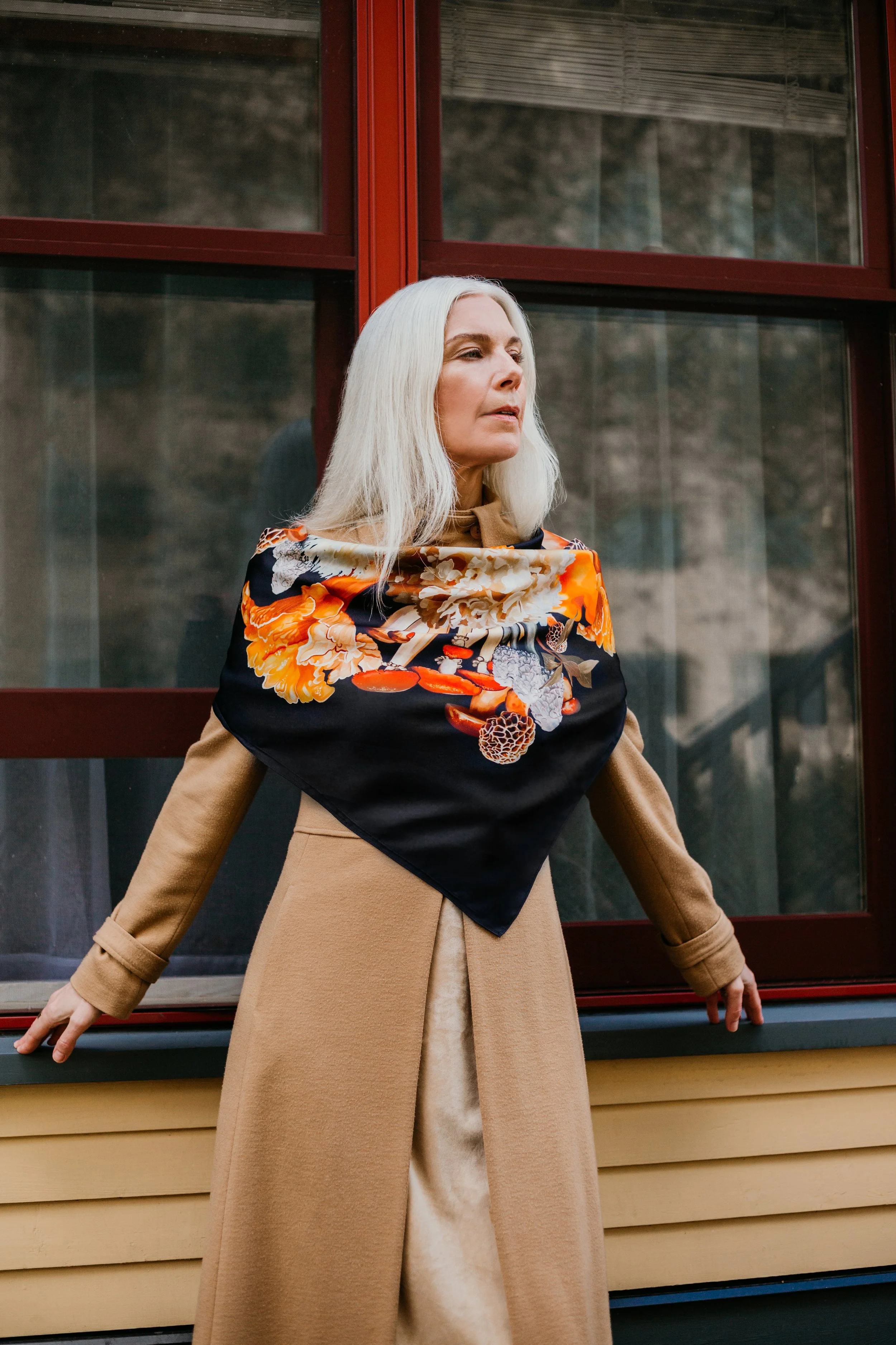 UNITY - in Black - silk scarf — woman wearing the designer scarf with a camel coat