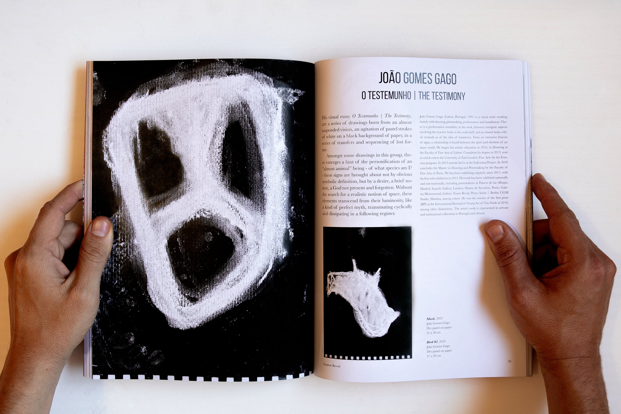 Pages with visual essay by João Gomes Gago, with his hands holding the magazine_FITA vol IV.jpg