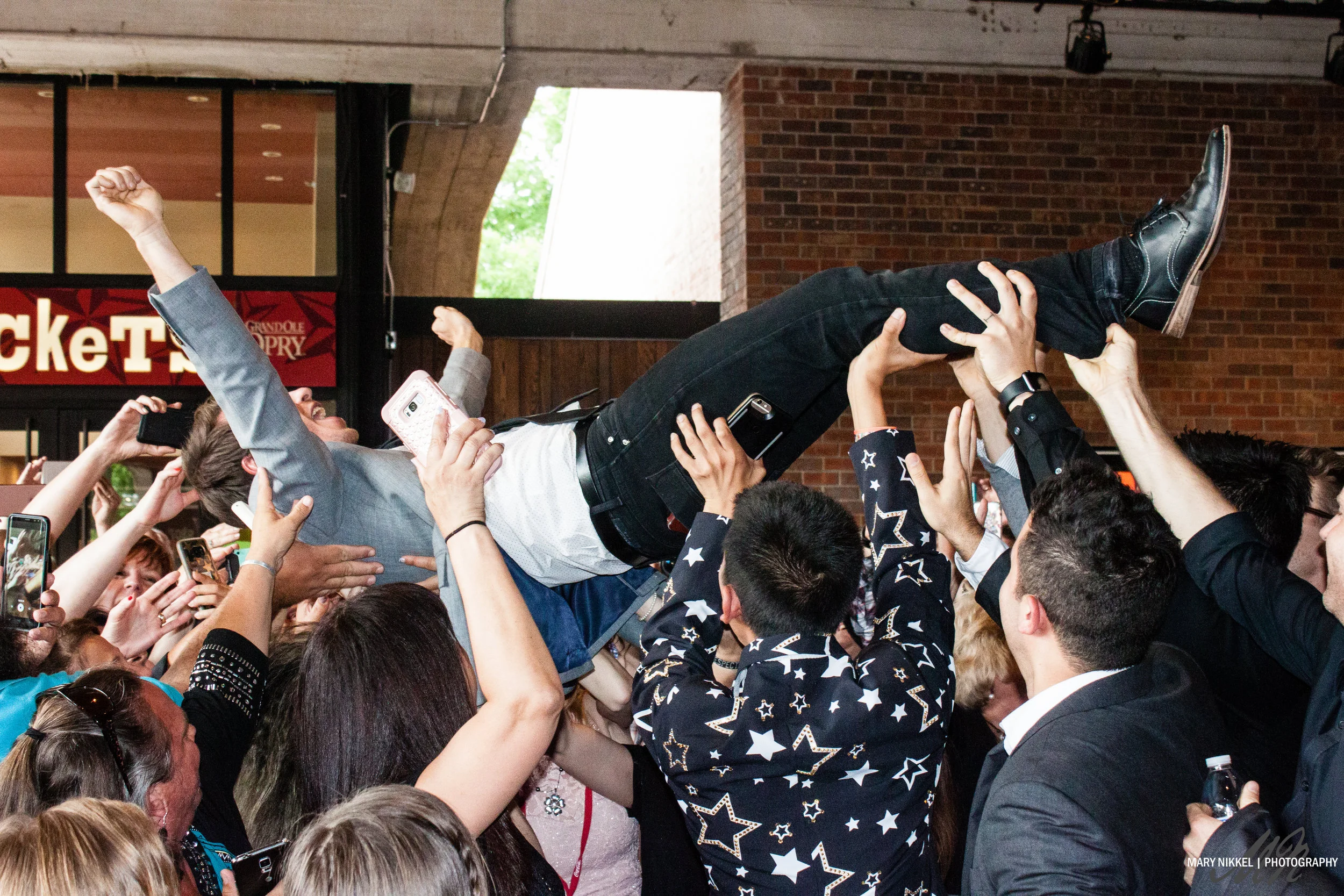Mike Donehey of Tenth Avenue North crowd surfs at the KLOVE Fan Awards 2017 in front of the Grand Ole Opry; shared on Mike Donehey's Instagram to 48k followers.
