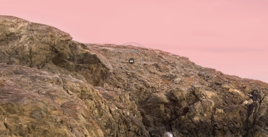 The gradient creates a problem with the rocks, however: they're too dark. So, I erase that portion of the gradient. (To make it easier to see, I've made the overlay visible, which appears as translucent red.)
