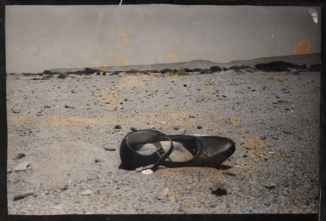 Update from Shoe From Peru FB page: On August 7, 2016, we learned that Claudia Luthi, kind soul and compassionate photographer, had passed away. She was much loved and is sorely missed! Claudia found the Shoe From Peru, a little girl's patent leather shoe, on a riverbed after a big flood in 1998. Starting in May 2008, the shoe travelled the world for six years before it finally returned to Claudia's home in Lima, Peru, in August 2014. This is one of the photos Claudia took of the shoe as she found it on that riverbed in the Rio Ica Valley nearly two decades ago.