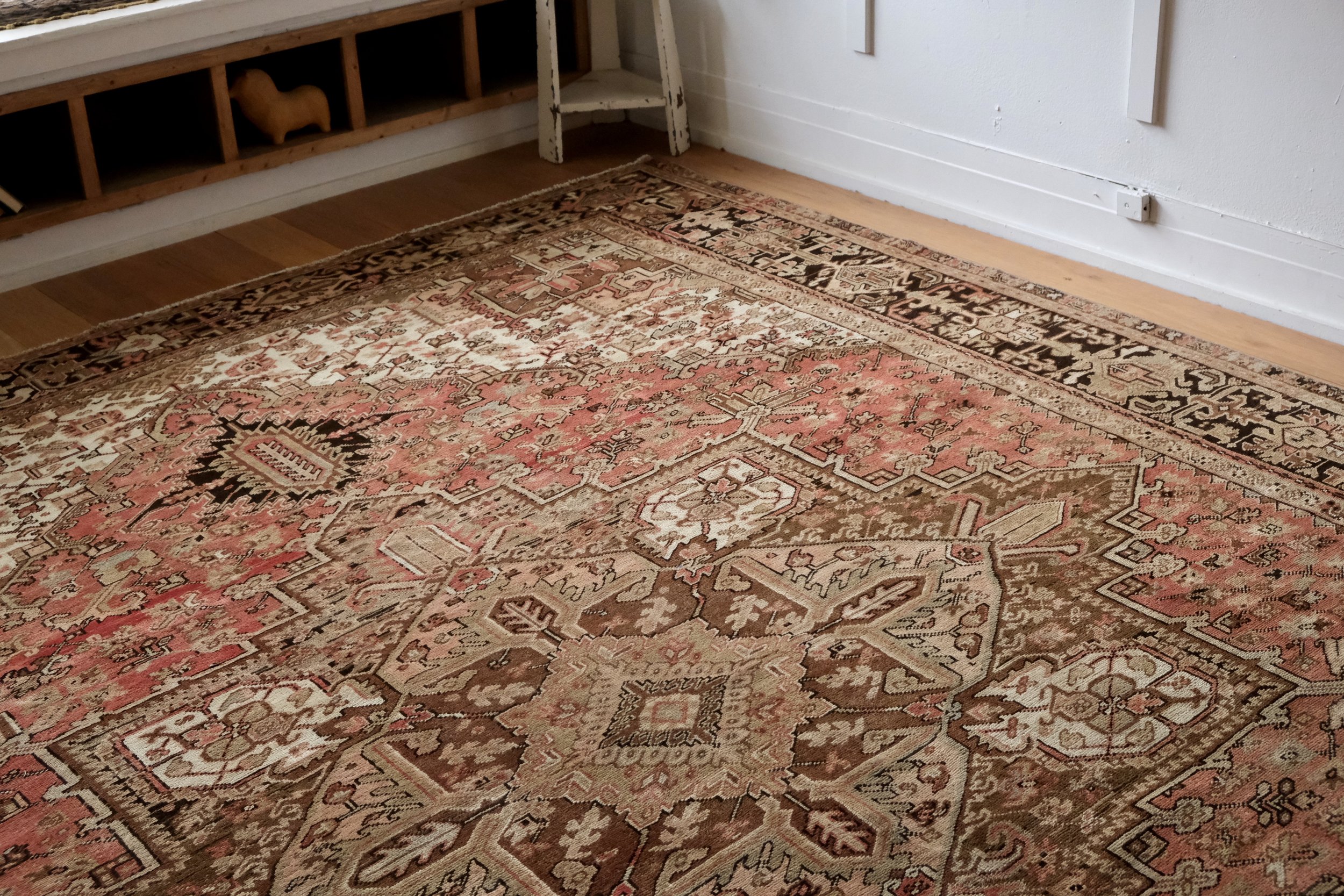 a corner of the vintage Persian Heriz rug styled in the studio