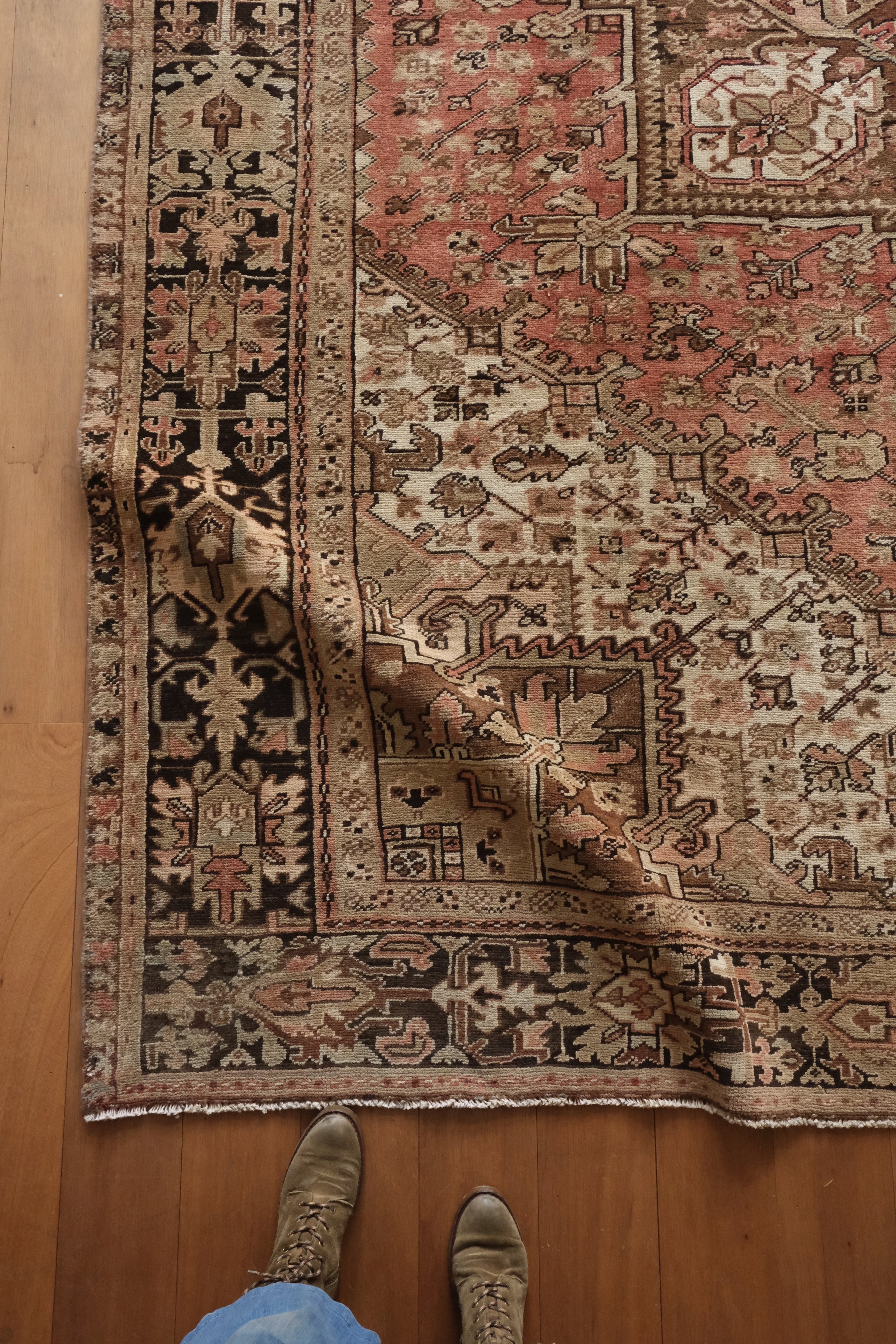 vintage Persian Heriz rug close up showing its sturdy handle