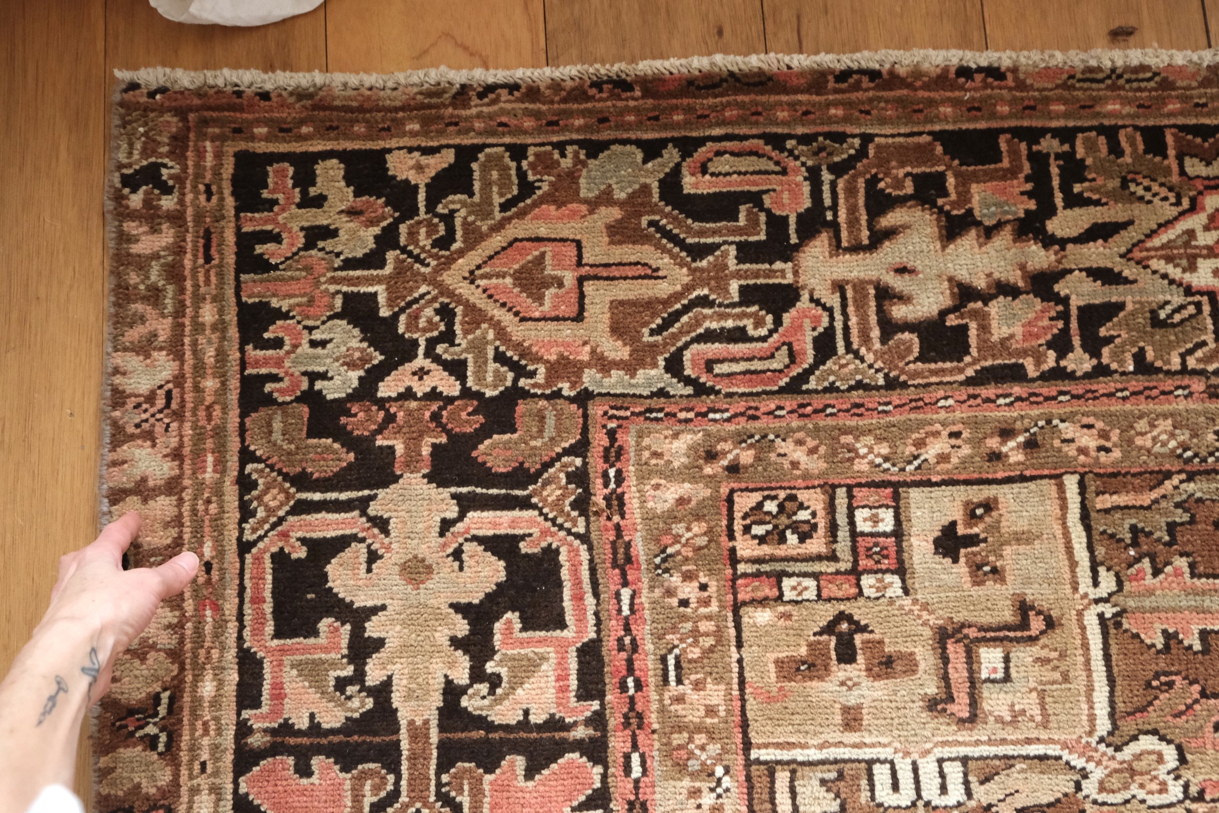 the corner of the vintage Persian Heriz rug