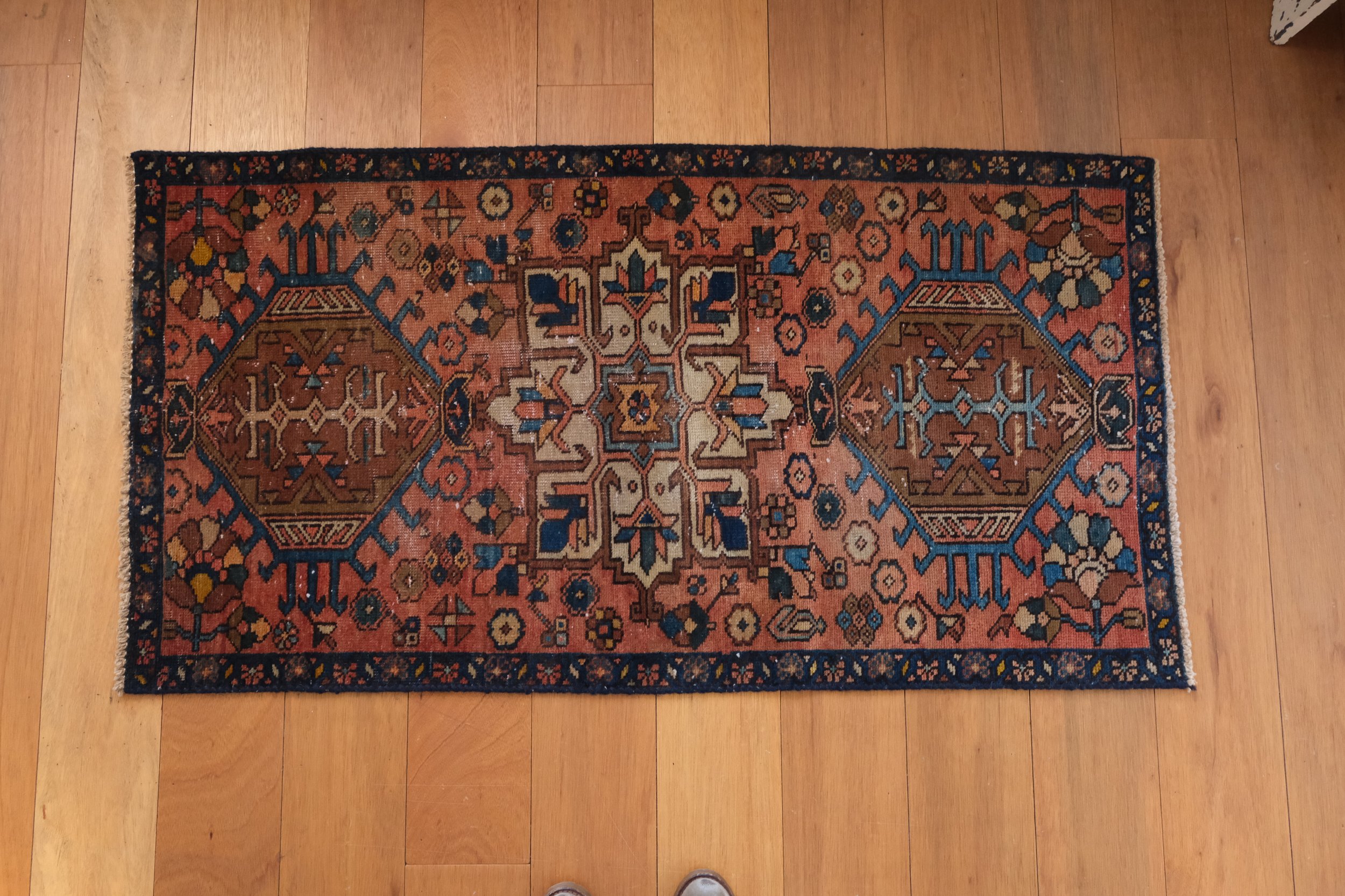 overhead photo of rug showing slightly non-rectangular shape