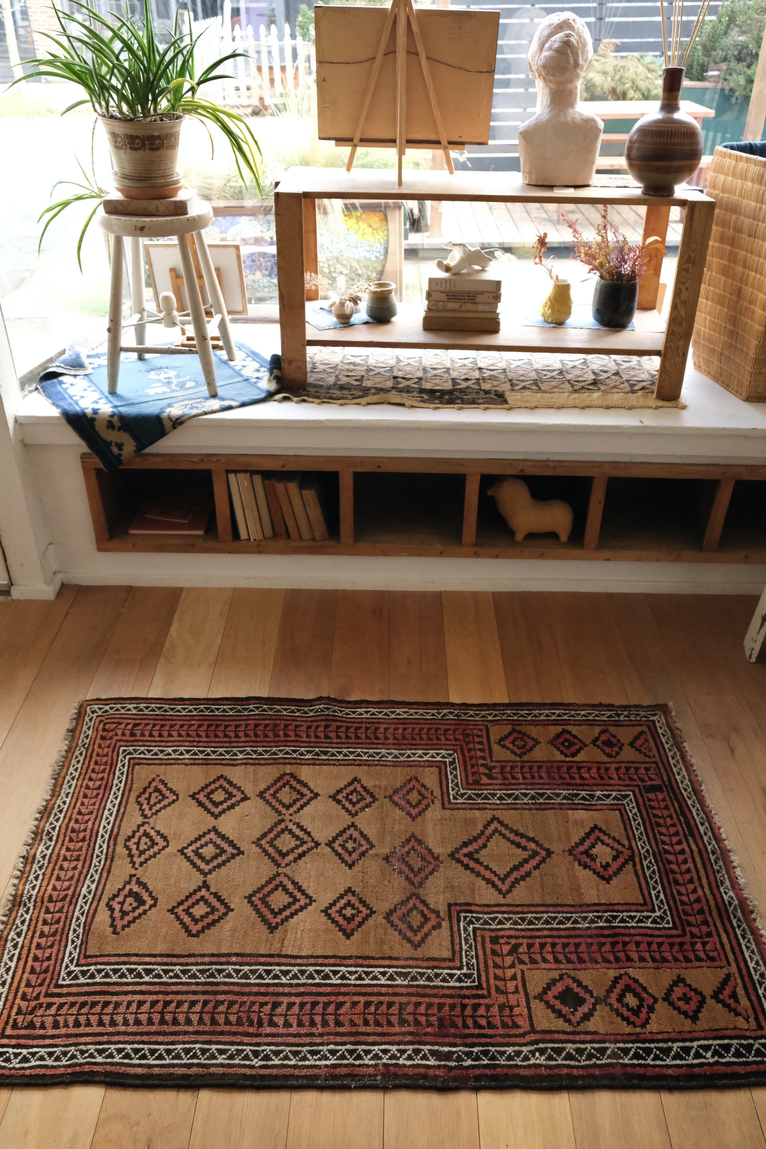 Balouch rug displayed lengthwise