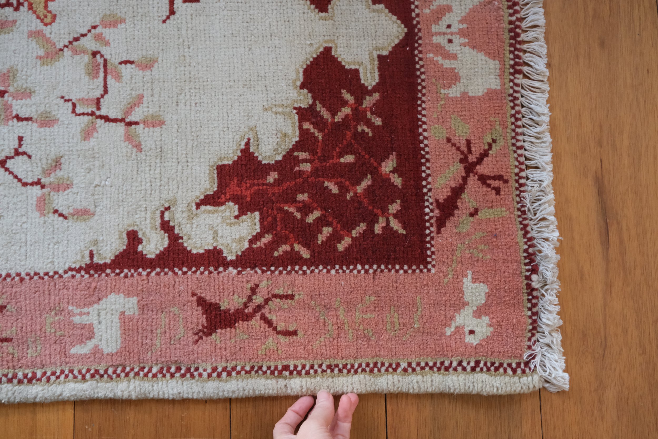 the shoulder of the rug shows the animals throughout the border