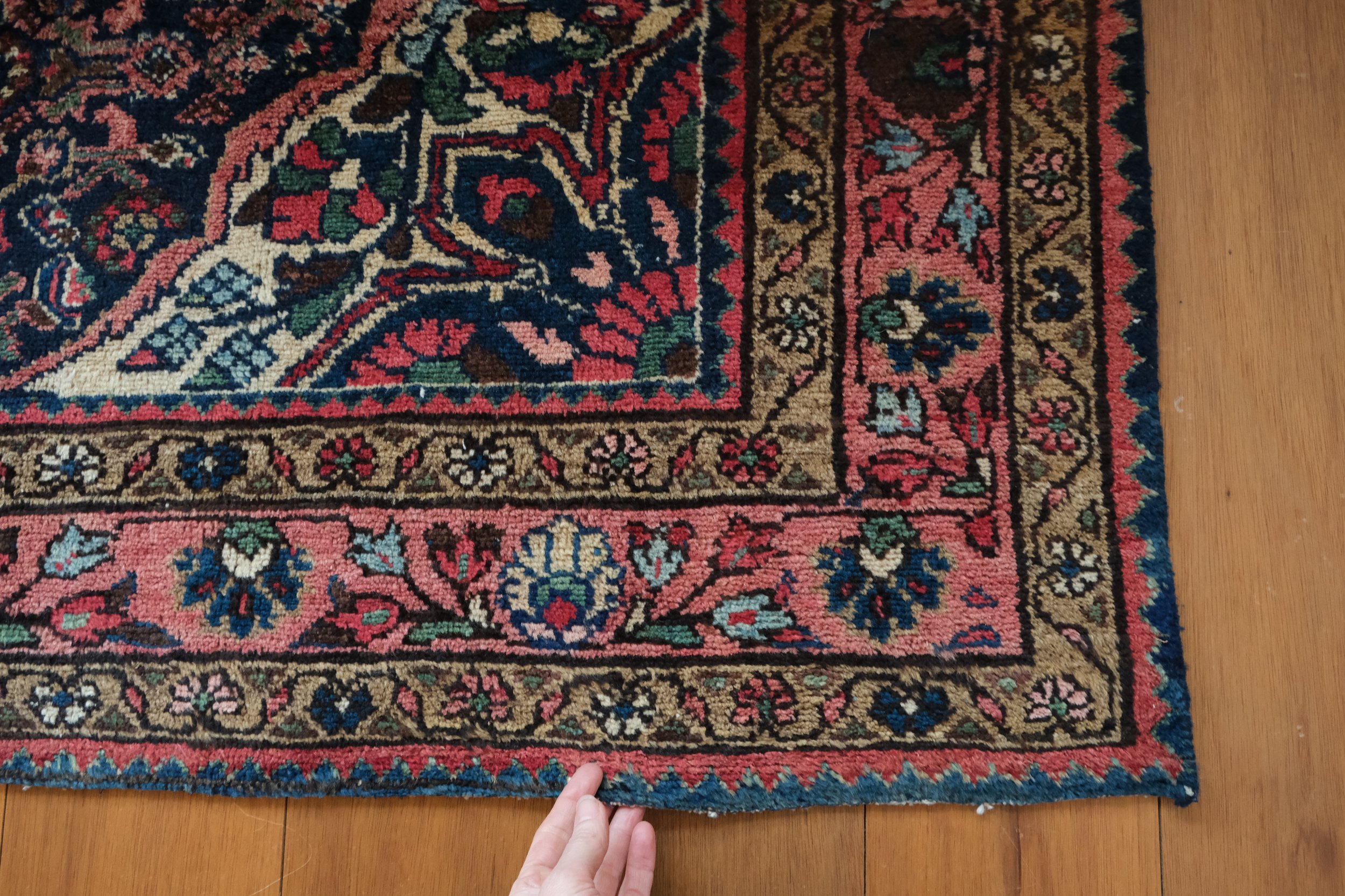 the rug border is intricate and floral