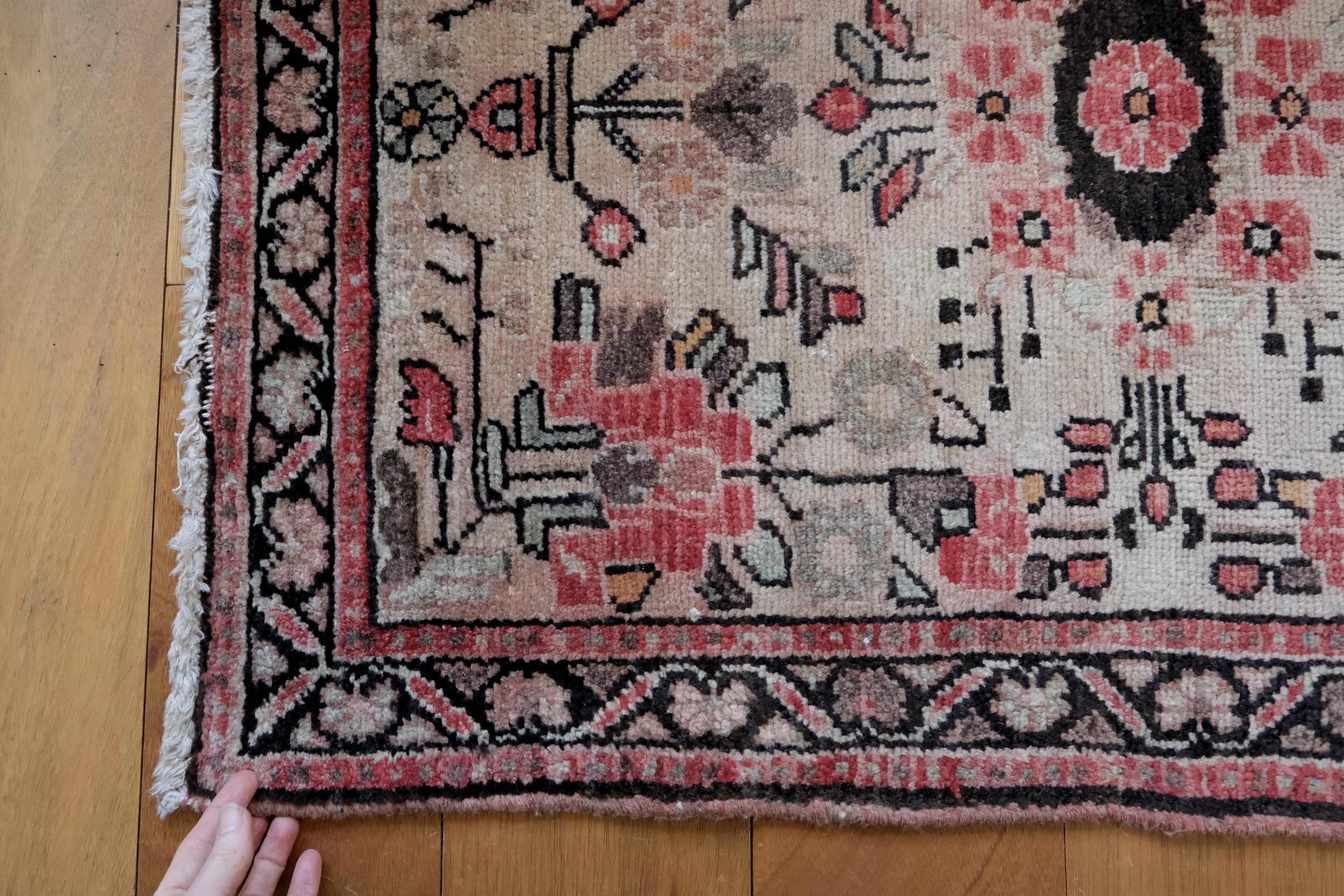 close-up of corner showing vermilion, espresso, and bone colors