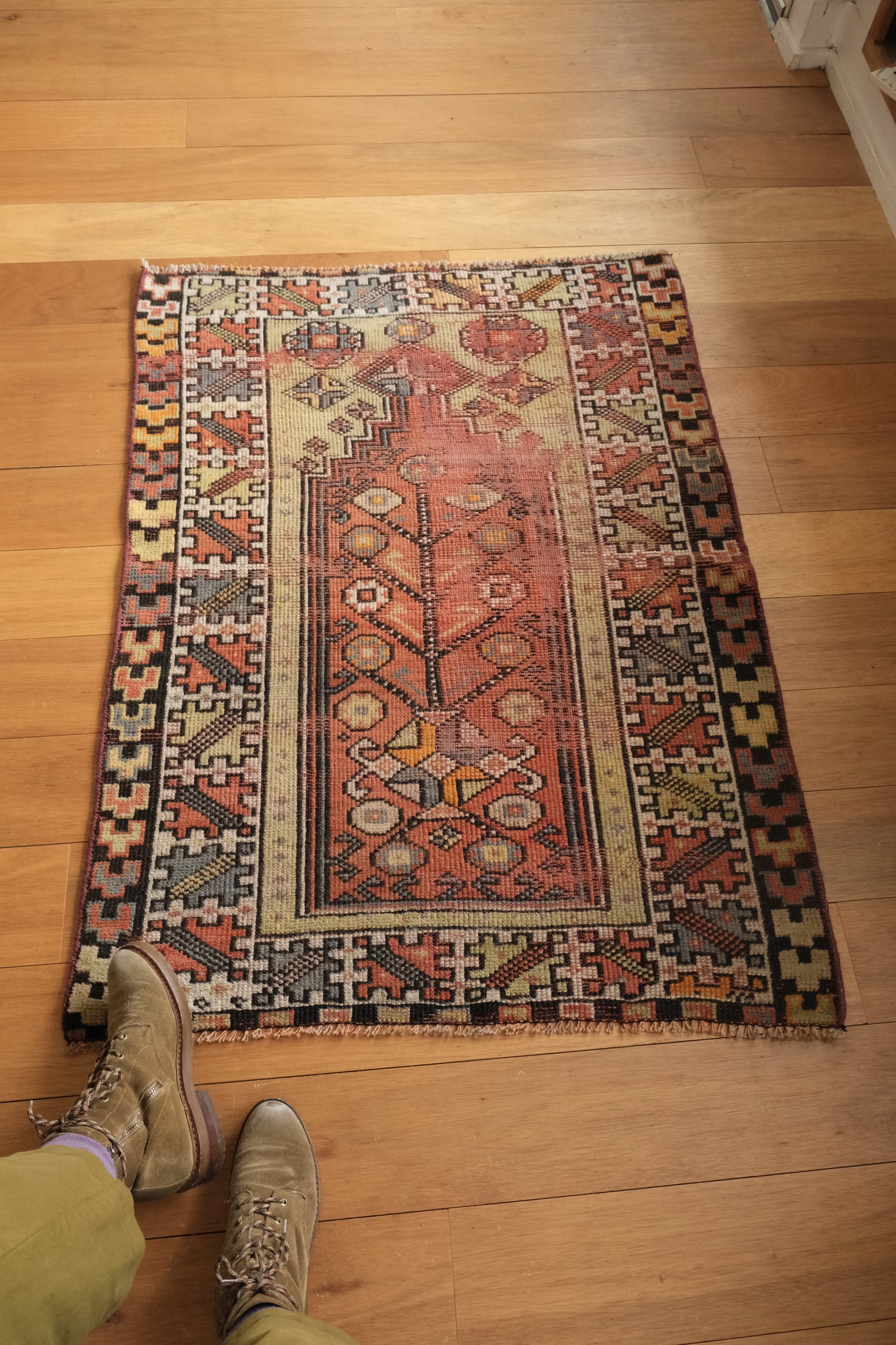 rug shown lengthwise on wood floor