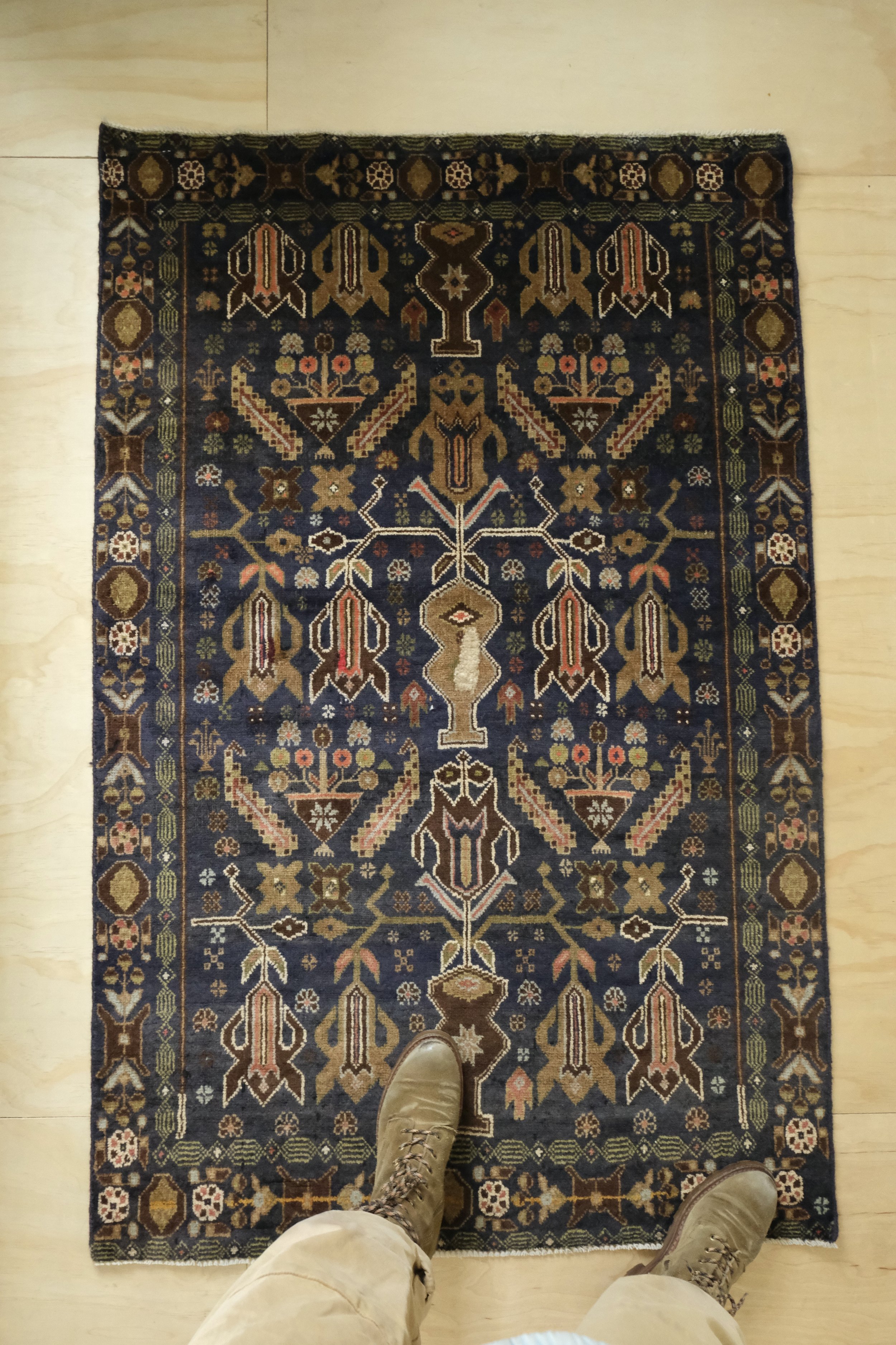 overhead view of vintage Balouch rug