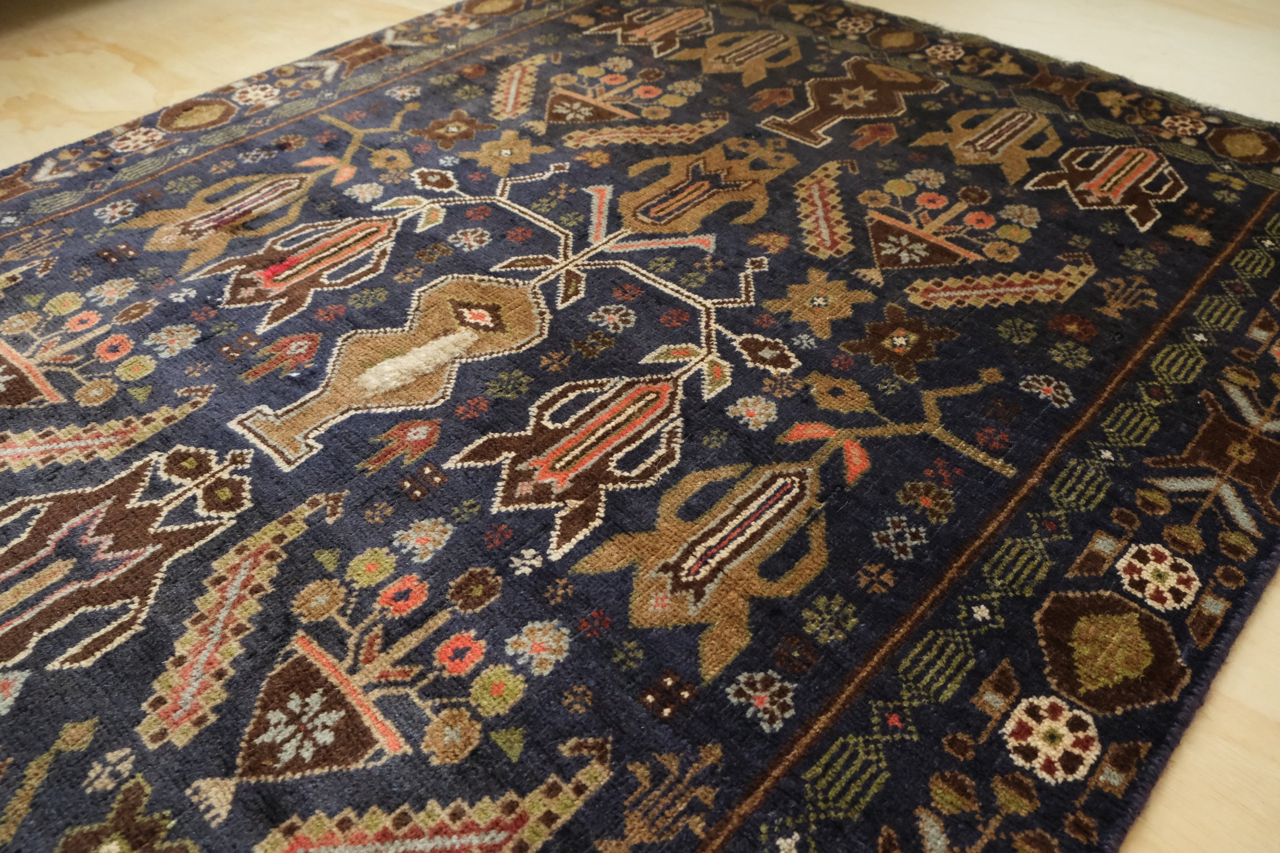 close-up of field of rug showing small geometric motifs