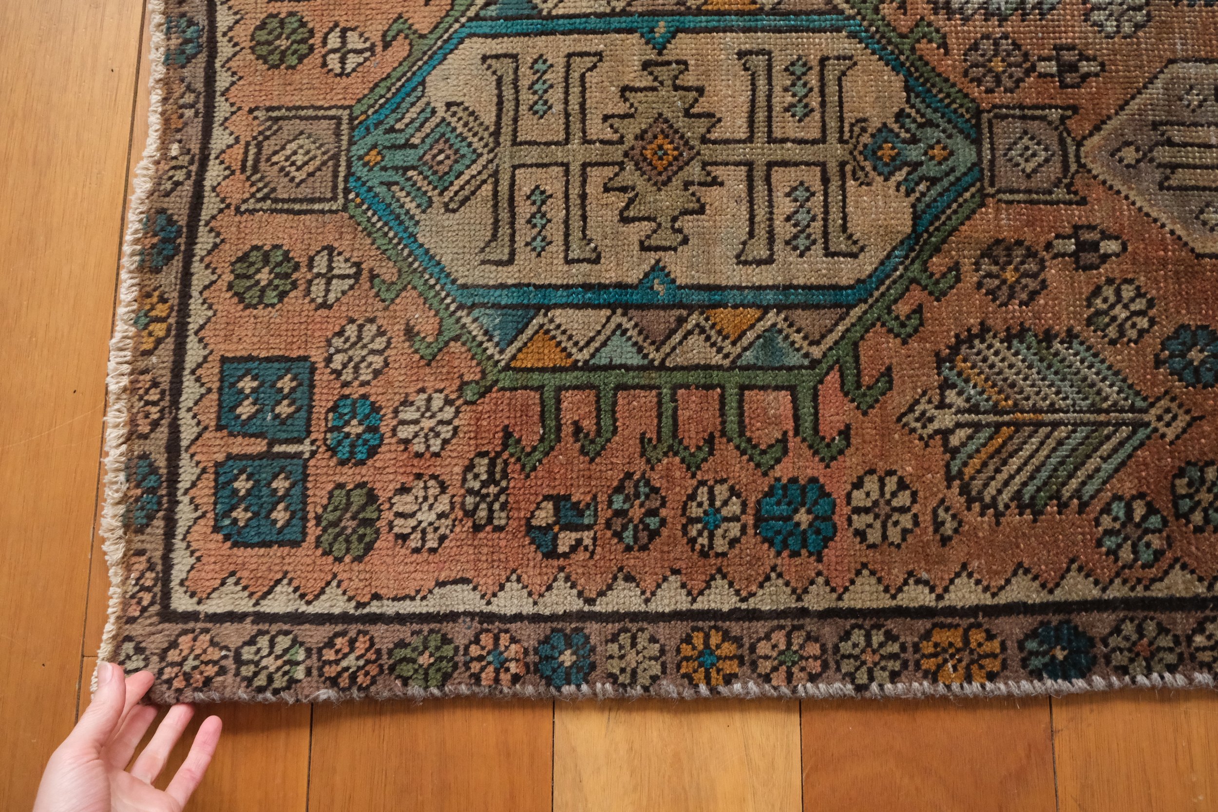 the shoulder of the rug