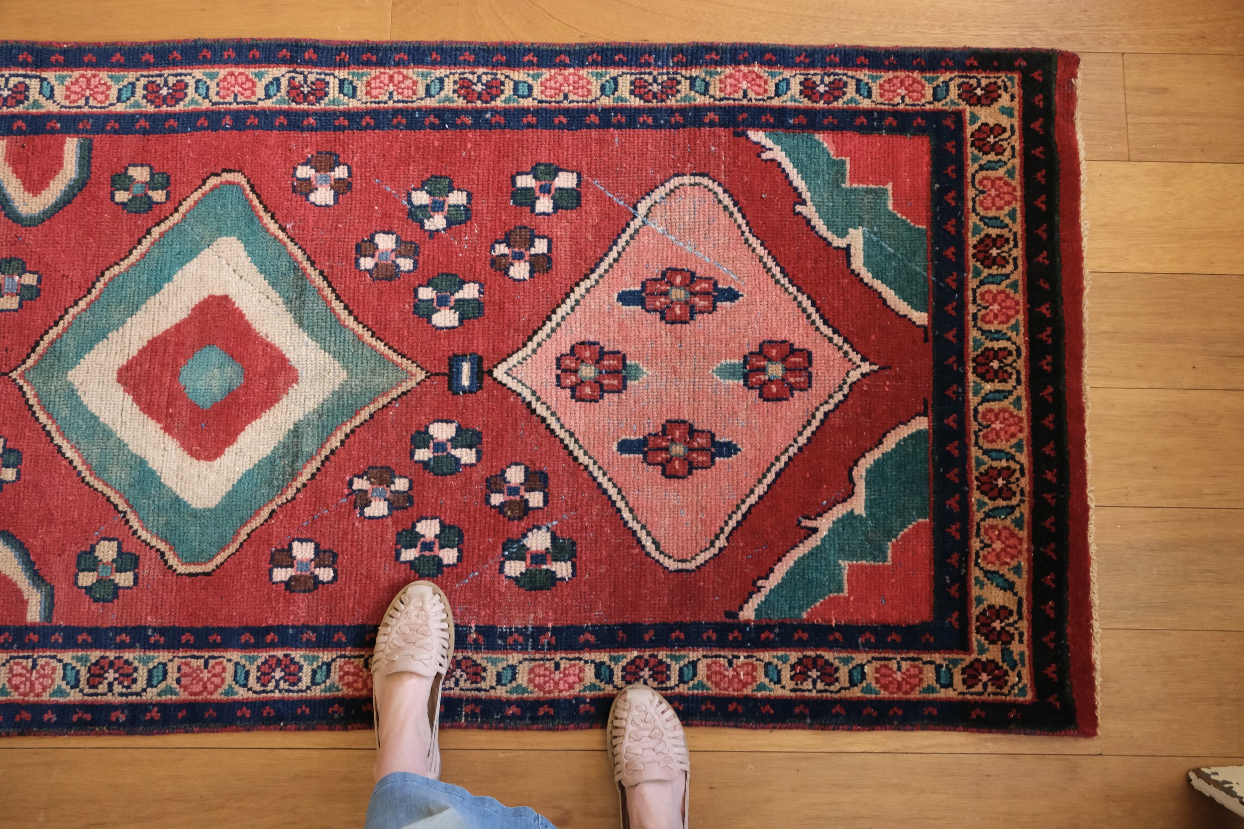 corner of Persian Gabbeh rug with open field