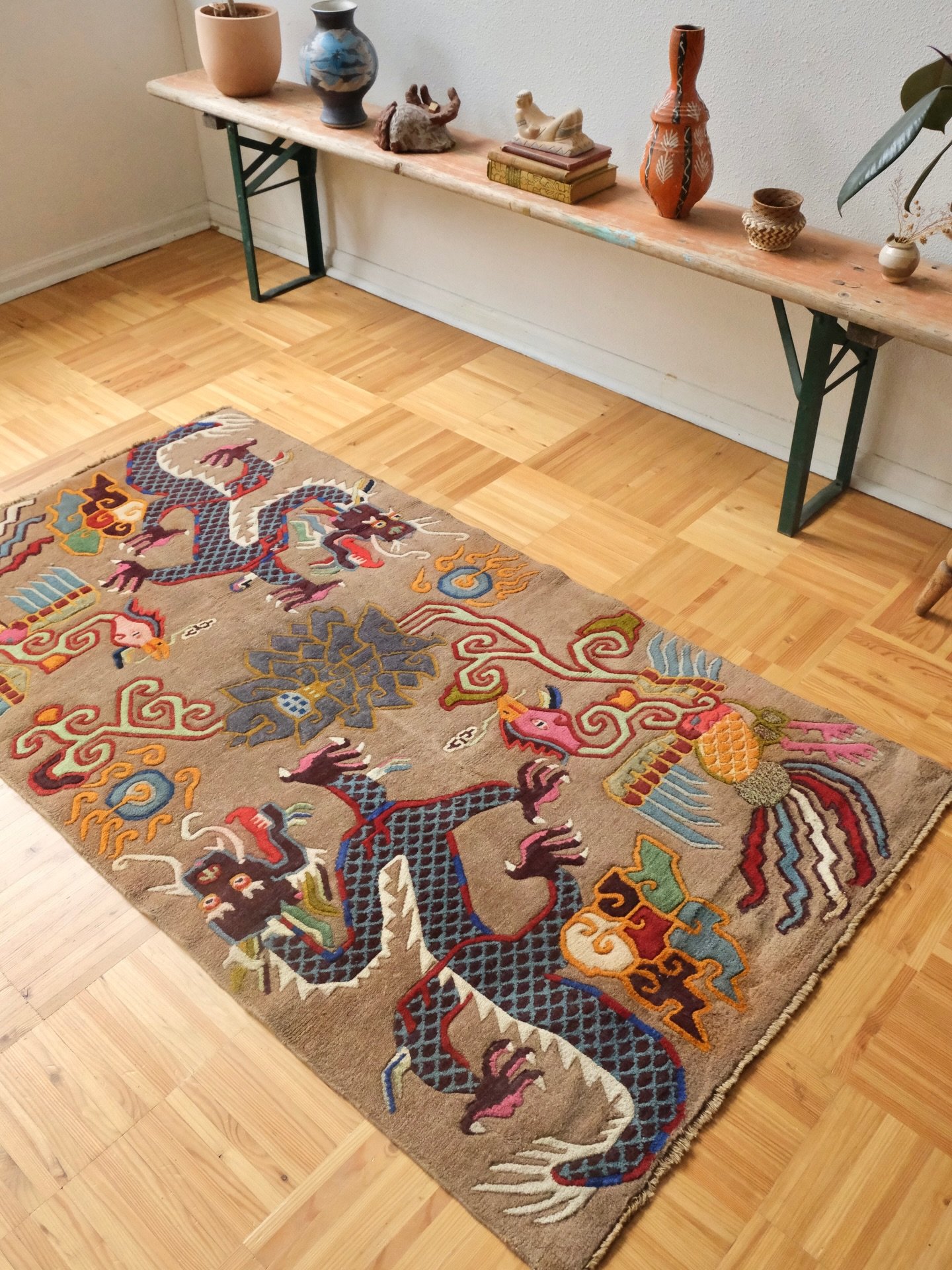 A closer look at my favorite vintage Tibetan rug from this weeks batch. What a lovely vibrant and colorful phoenix and dragon design set over a more rare neutral field color. This beauty has gorgeous 3 dimensional relief in the pile, meaning the pile