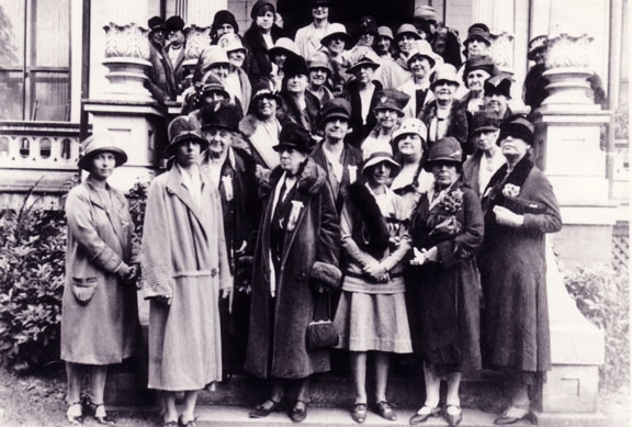 In 1928, club members and their guests posed on the front steps of the Amherst Woman’s Club, celebrating the 35th year as a club. On the front row stands Amy Barnes Maynard, founder of the club (third from left facing photo). 