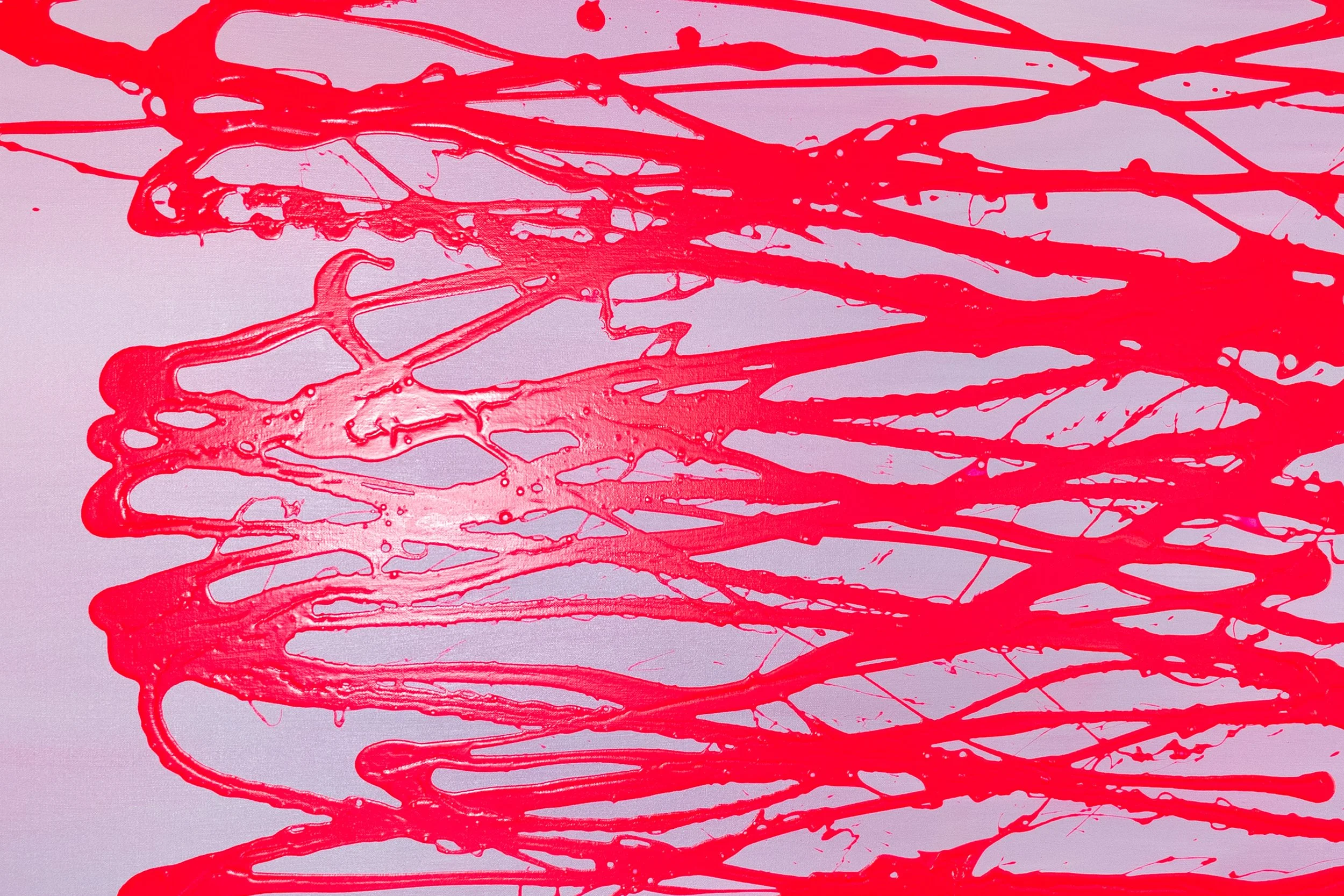 Abstract art with red paint splattered and dripped across a light purple background.