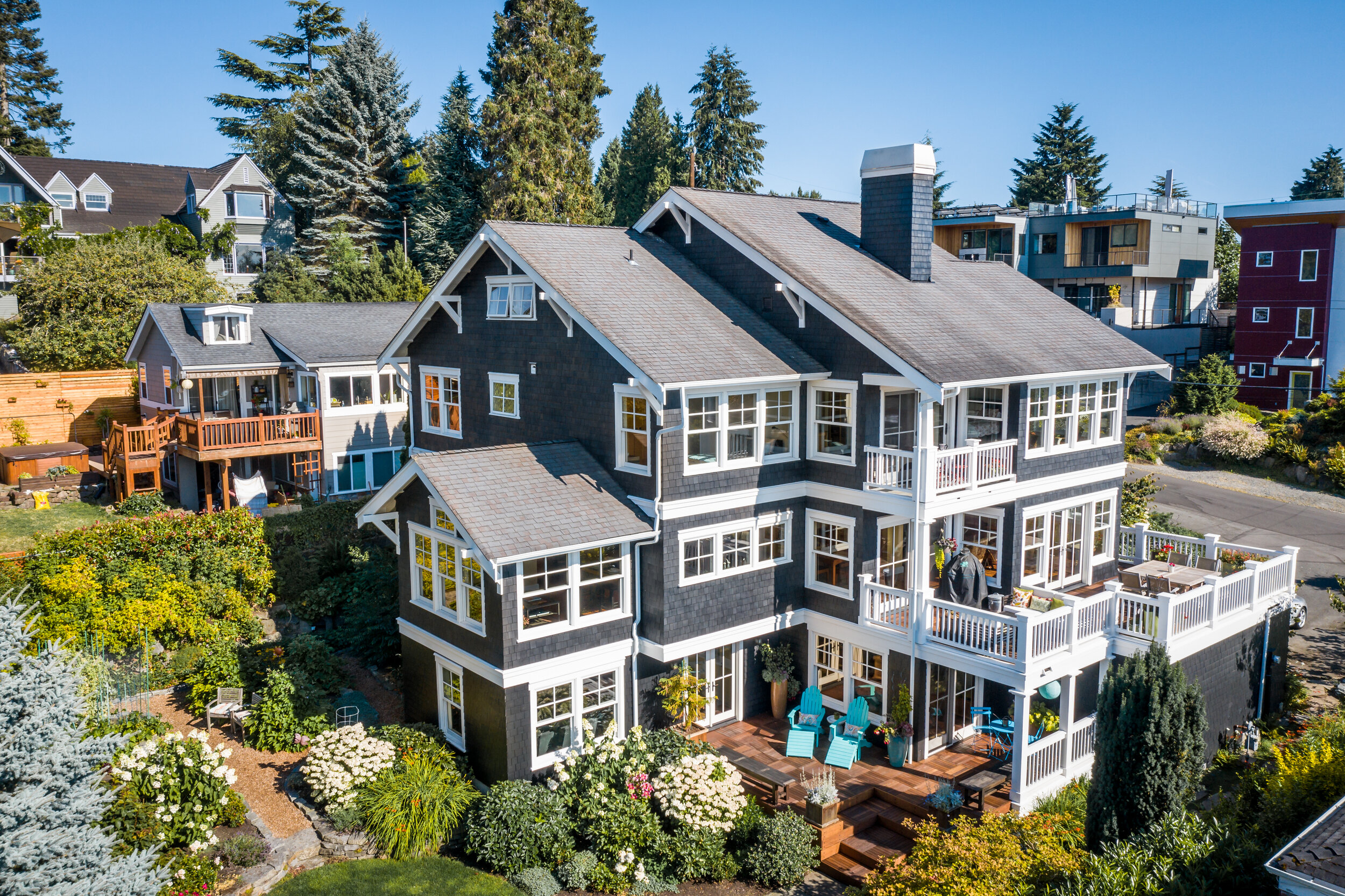 aerial view of custom craftsman with landscaped yard