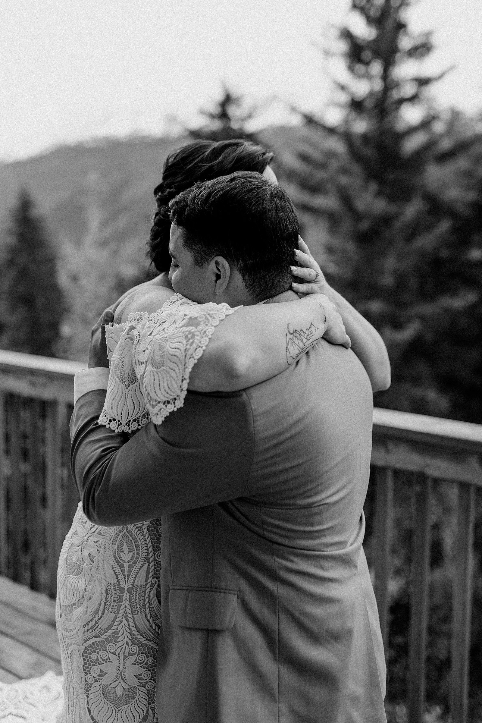  Bride and groom embracing after first look for their Girdwood Elopement in Alaska 