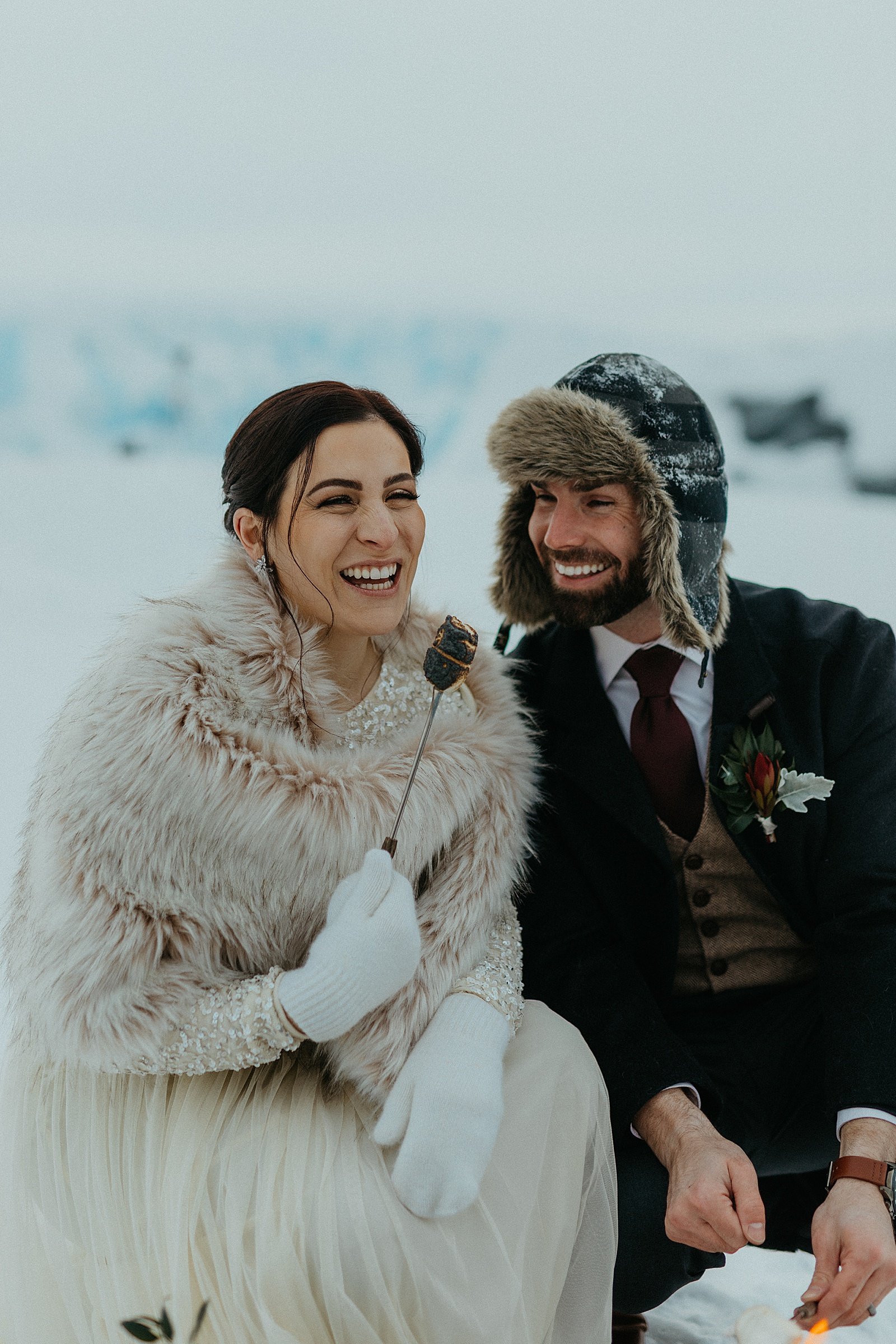  Bride and groom laughing together after their ceremony by  Alaska wedding photographer 
